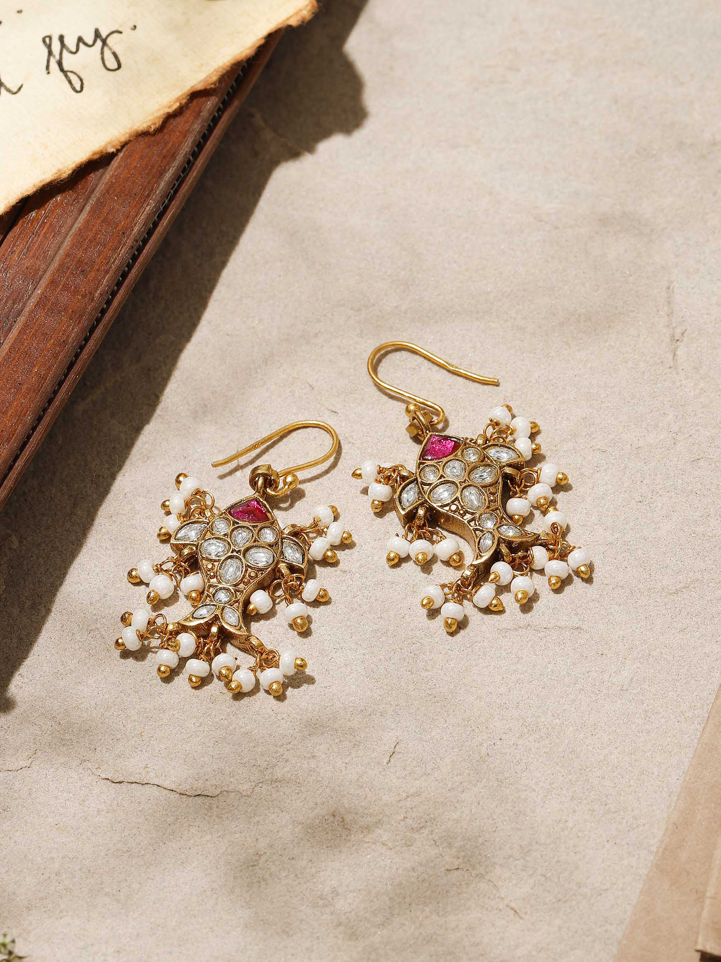 Close-up focusing on the intricate textures and artistic patterns of the silver drops