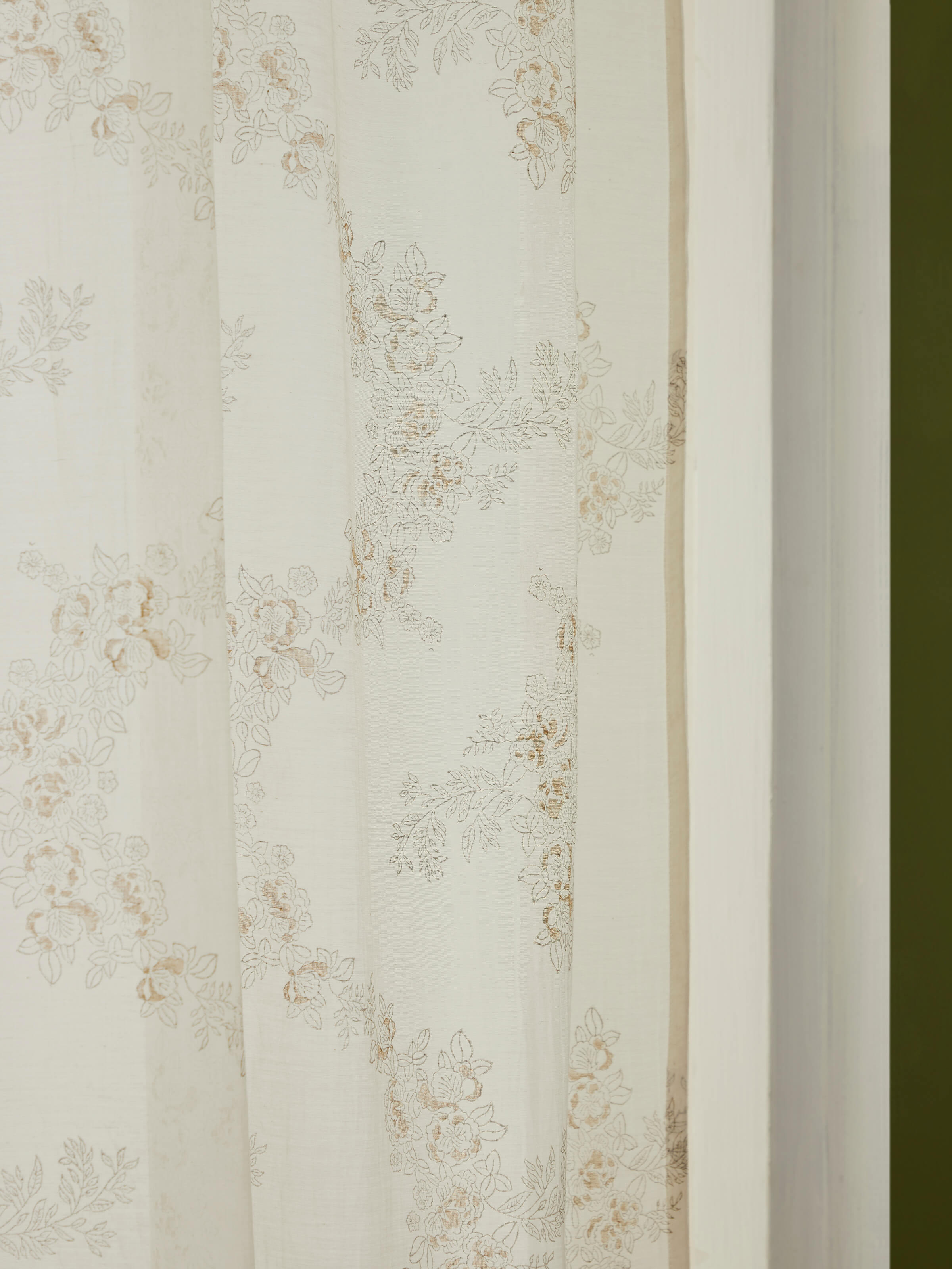 Detail shot of Shivranjini Ivory & Blue Curtain, highlighting floral trellis design and hand block printing technique.