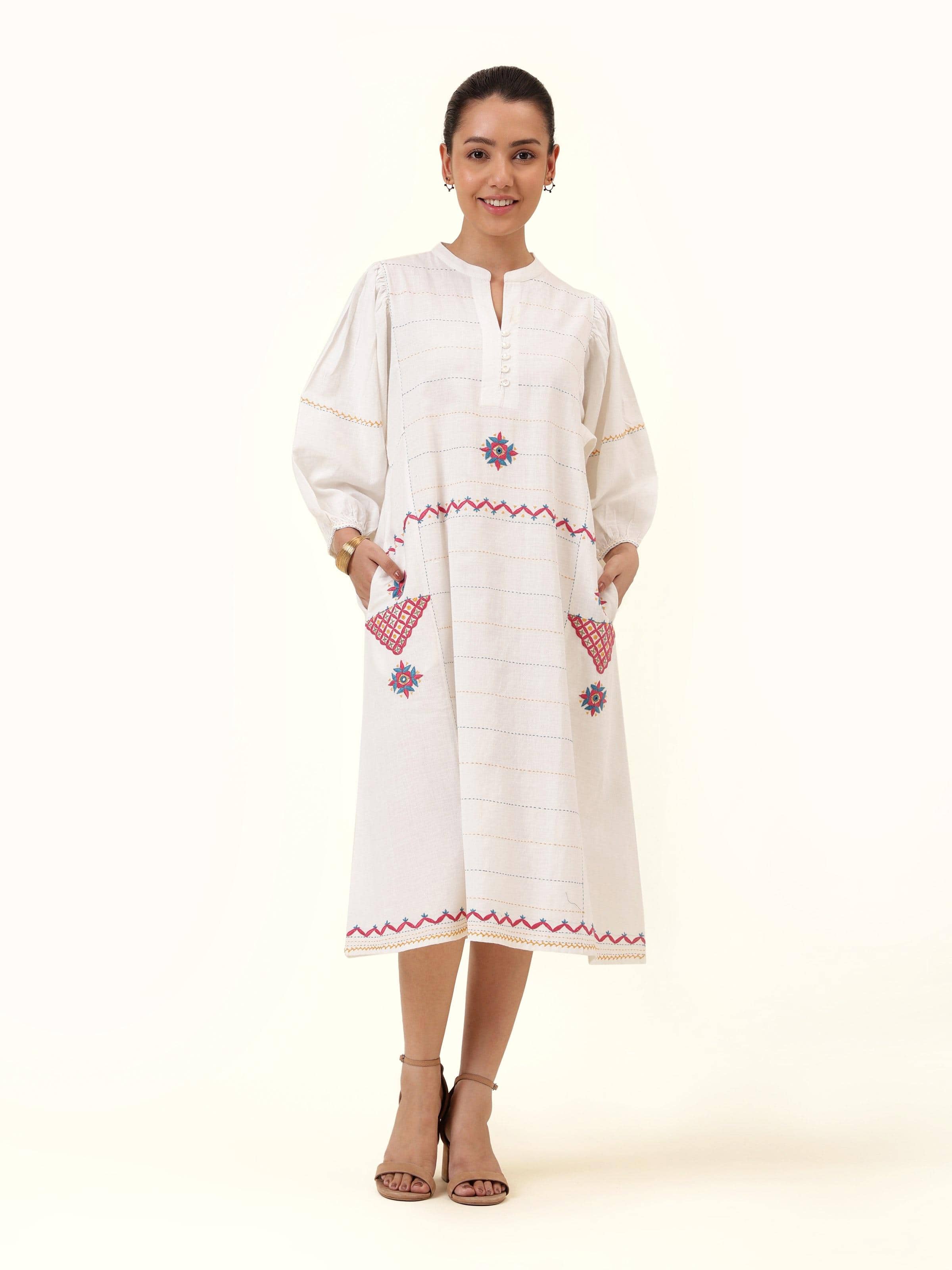 Front view highlighting the subtle off-white cotton dress, adorned with traditional Rajasthani embroidery for a graceful appeal.