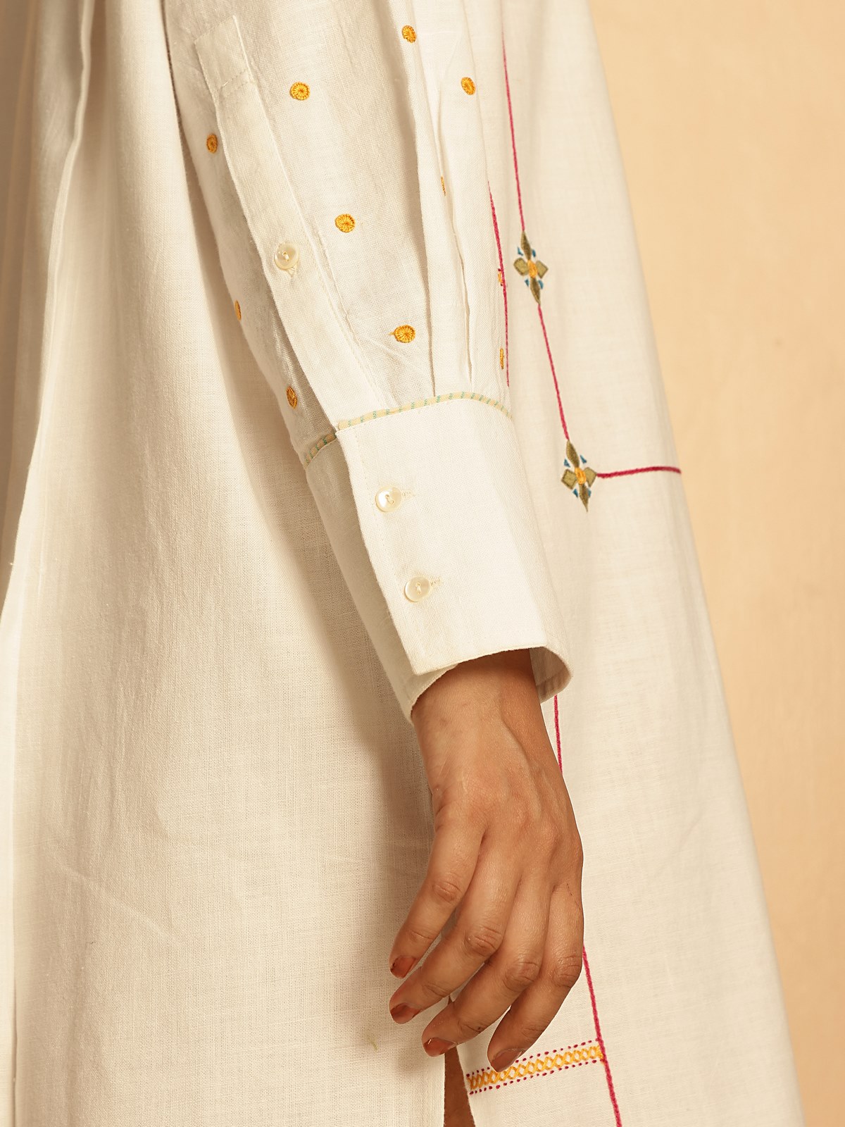 Another lifestyle view of embroidered shirt highlighting front motifs and traditional style.
