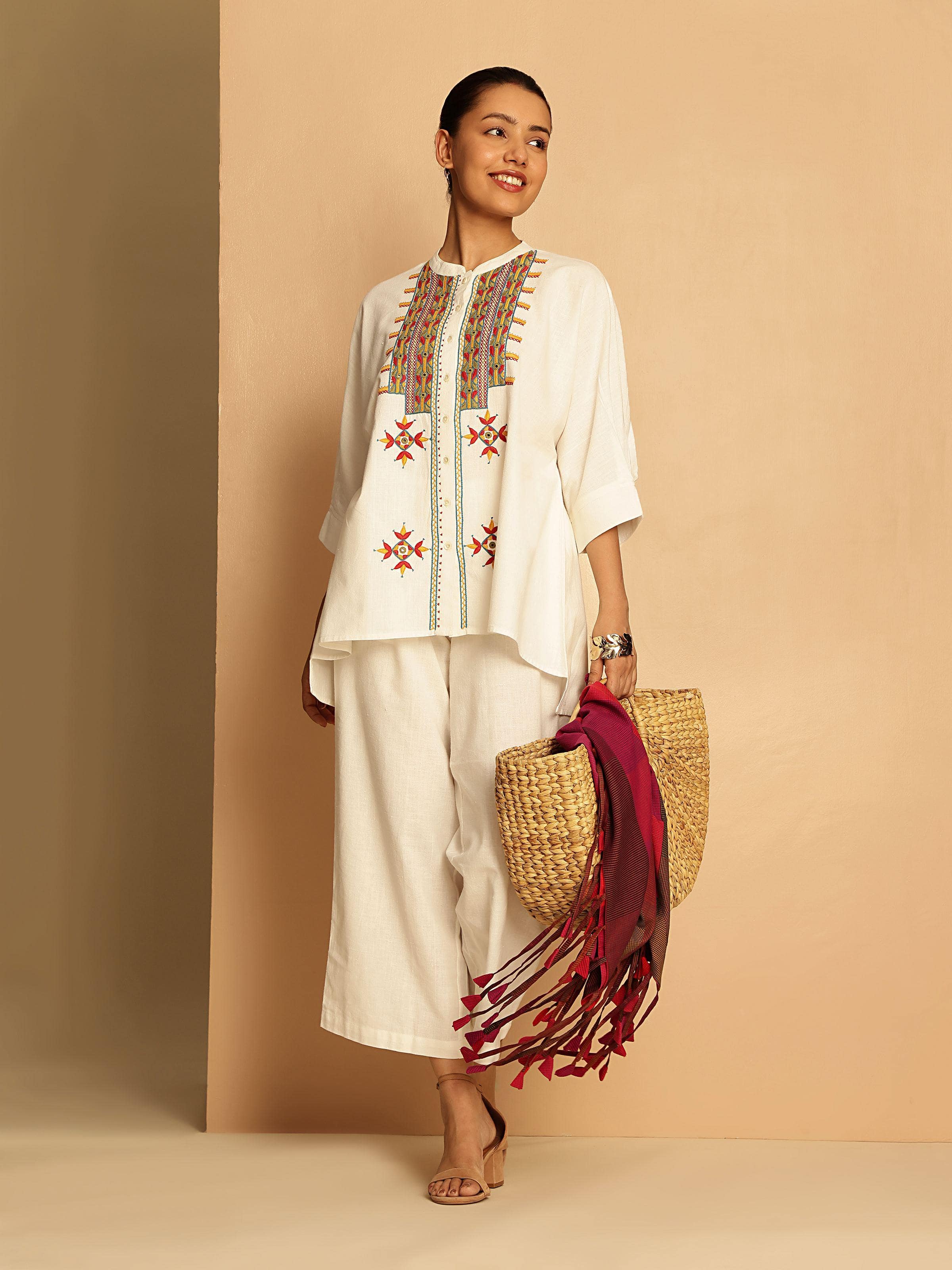 Lifestyle image of Off-white Cotton Pakko Rajasthani Embroidered Shirt worn traditionally