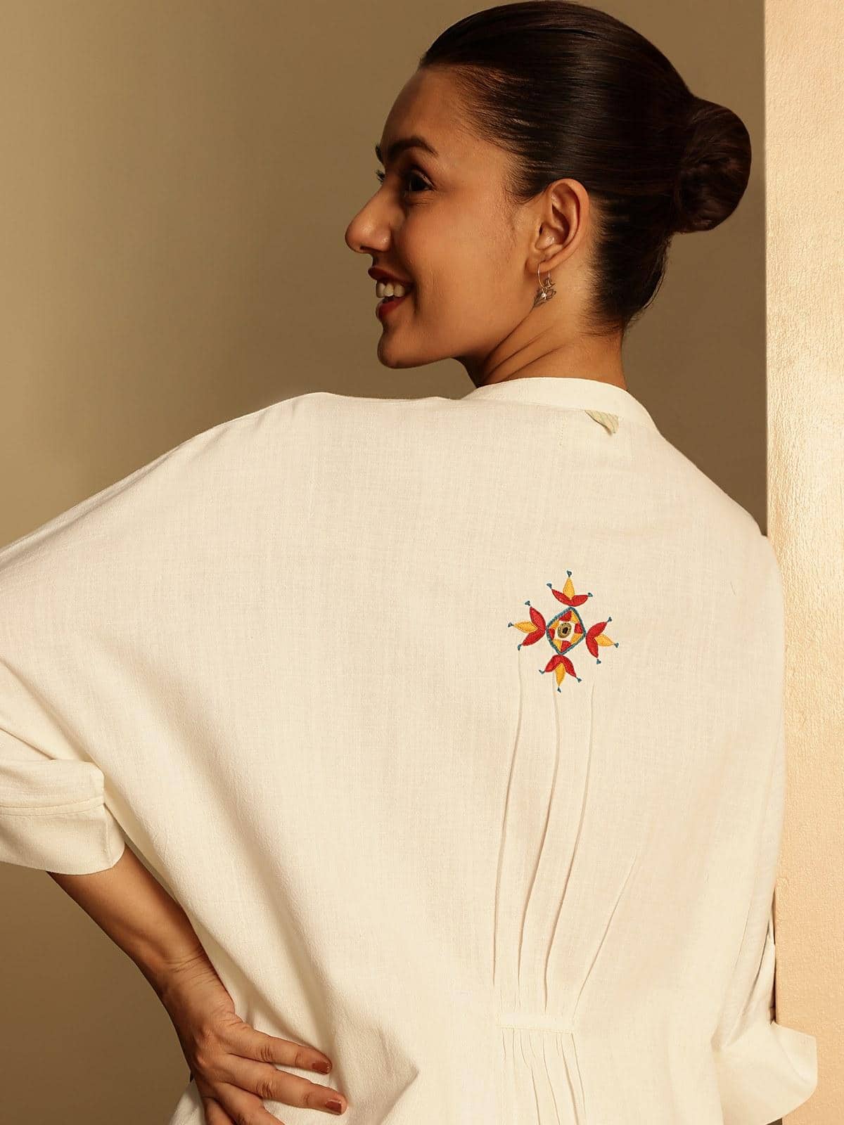 Detailed close-up of hand embroidery on shirt front