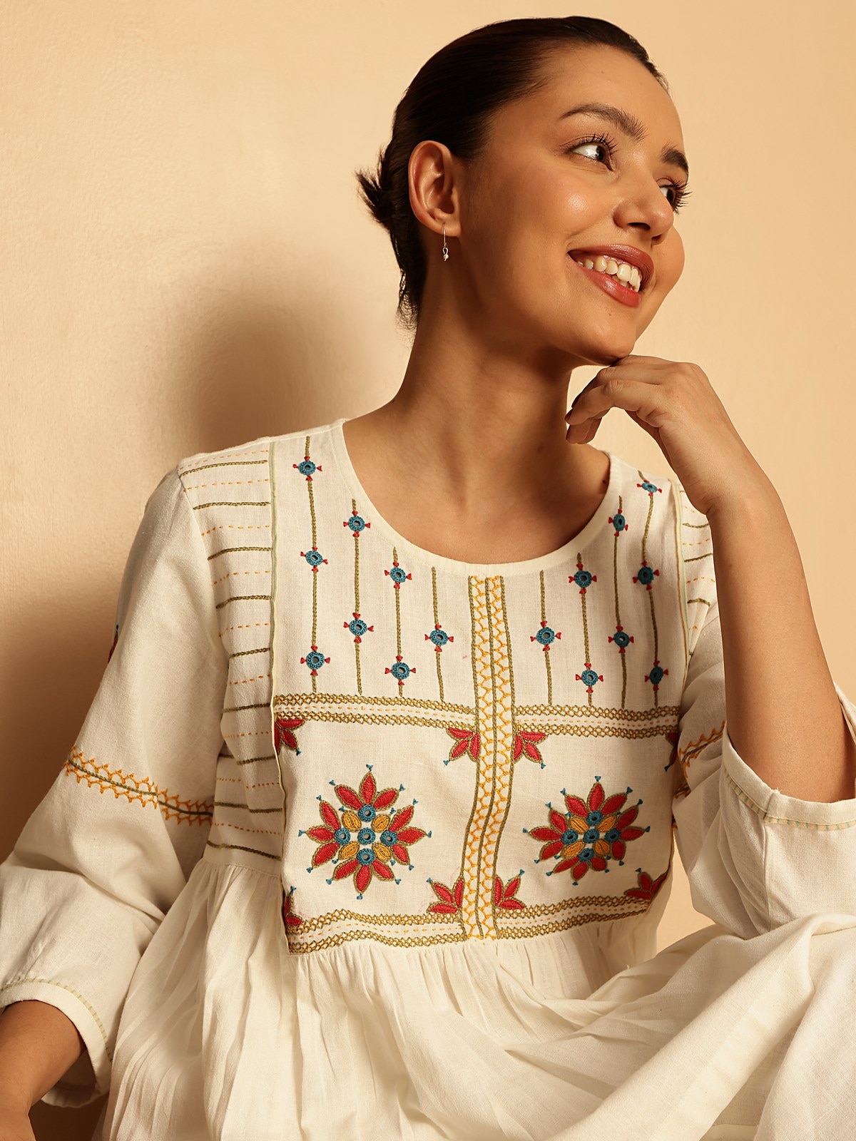 Side lifestyle view capturing embroidery and relaxed silhouette.