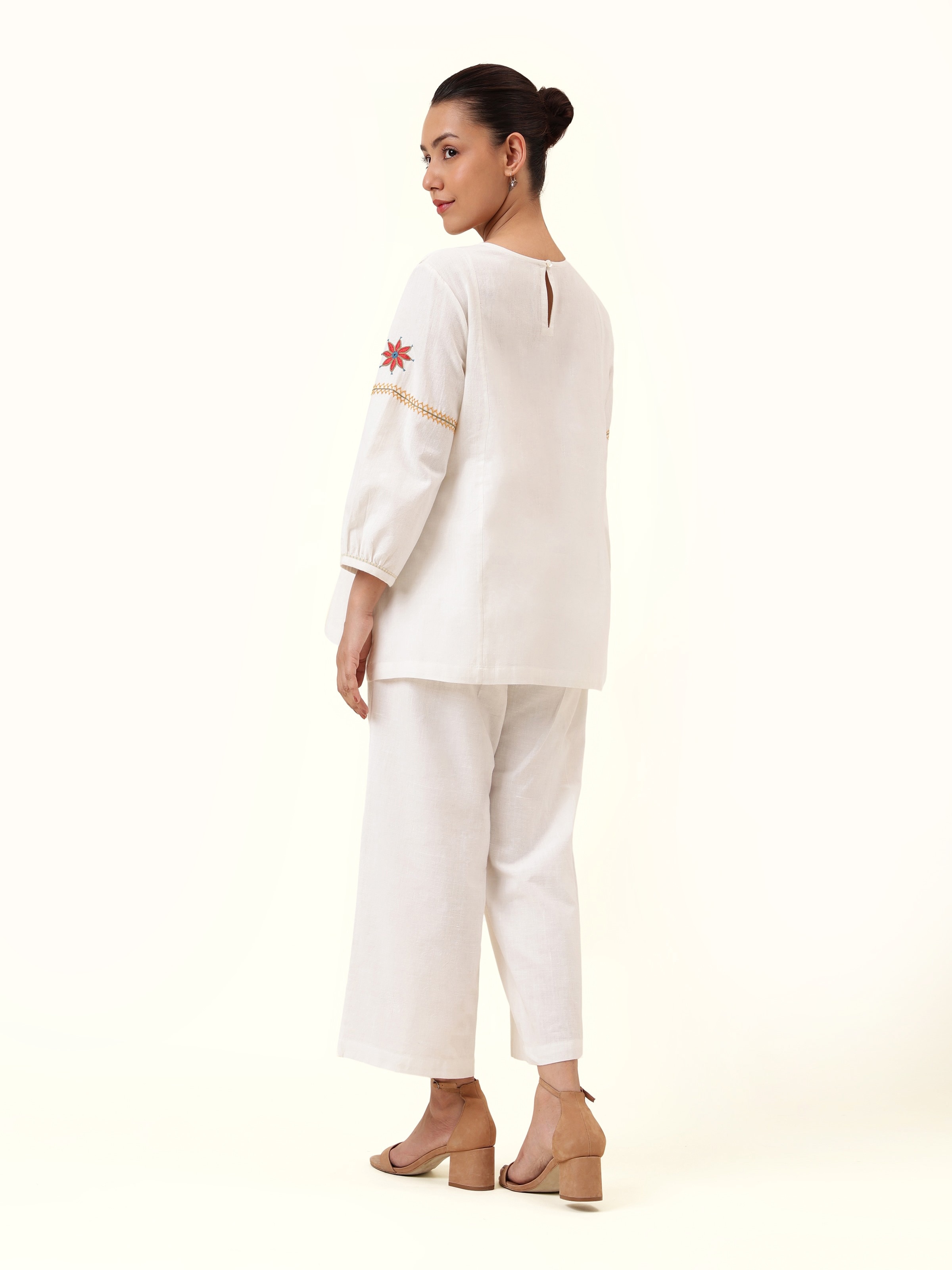 Back view showcasing back button placket and plain fabric body.