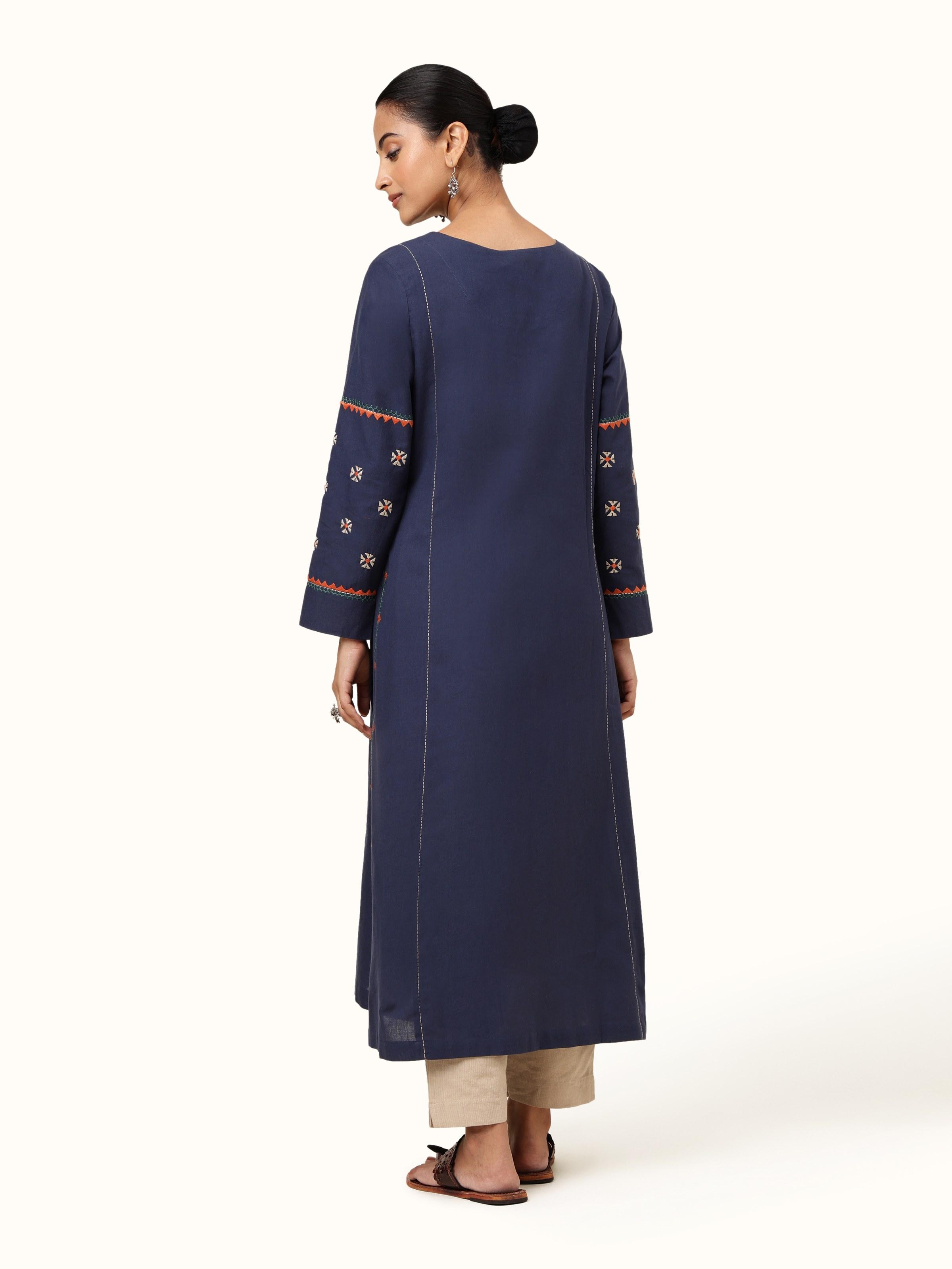 Back view of indigo cotton kurta showing plain back panel and straight hemline