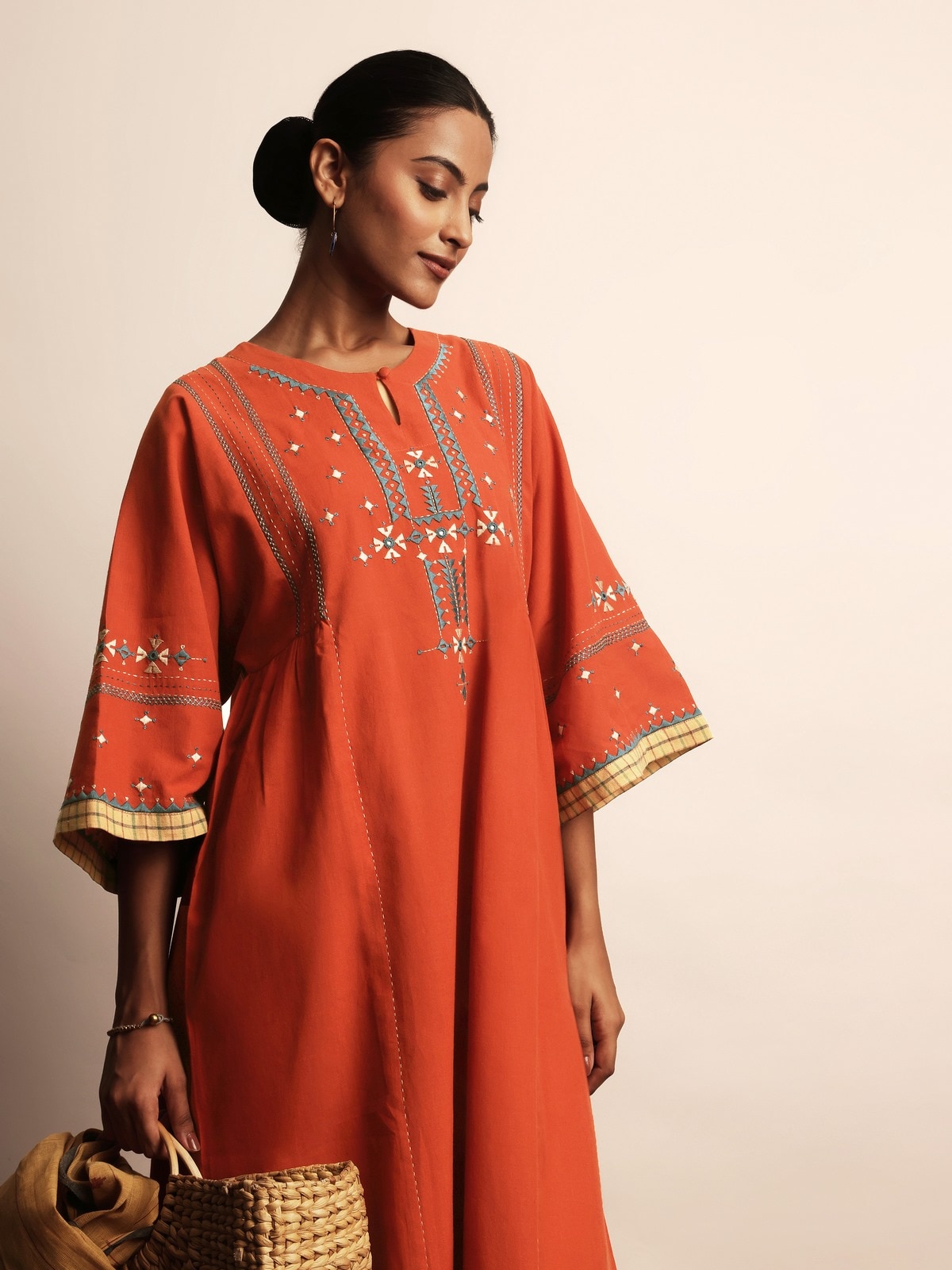 Alternate lifestyle view of rust embroidered kurta paired with dupatta