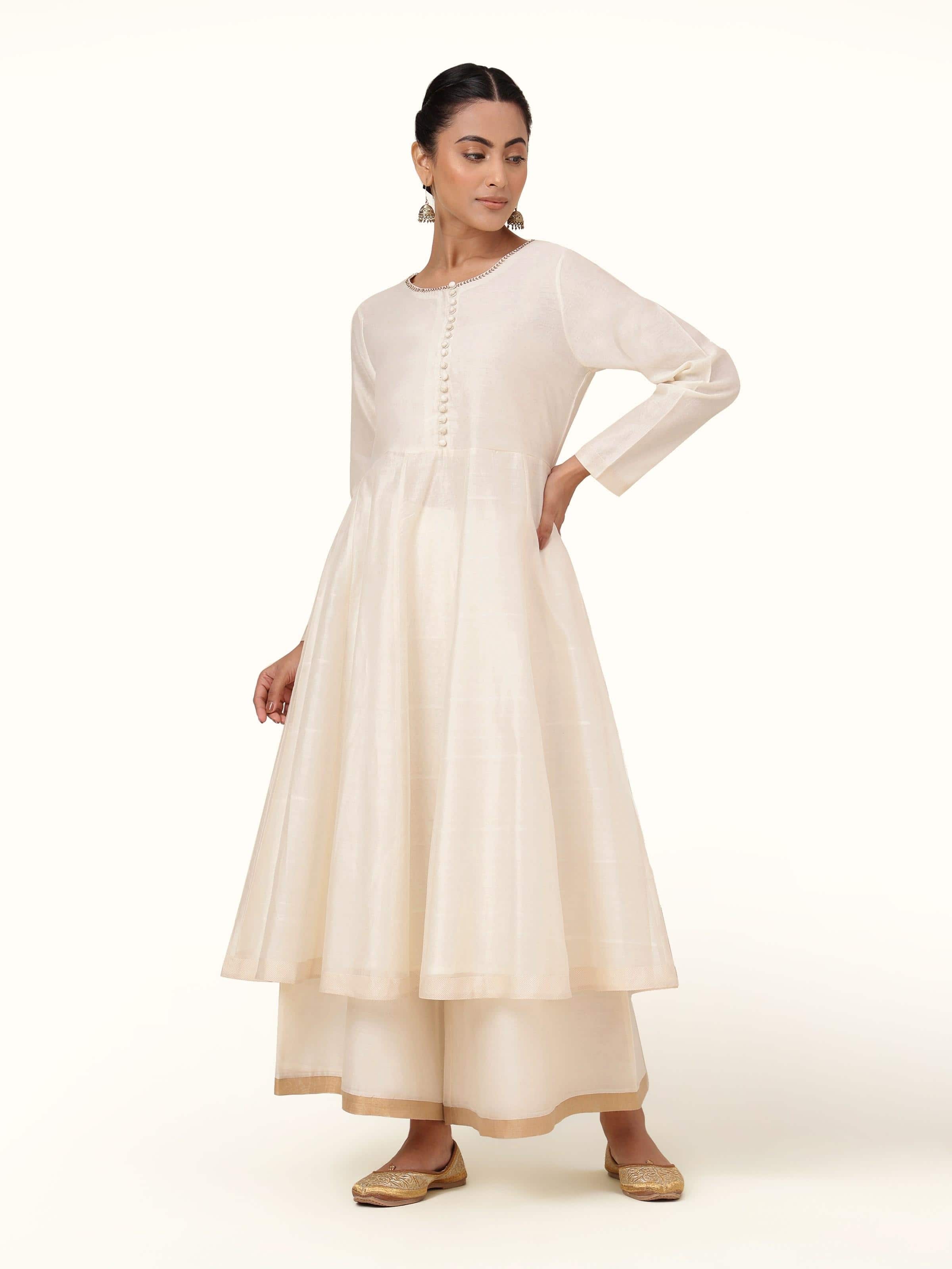 Front view of off-white cotton silk Chanderi Anarkali kurta featuring subtle sheen and flared silhouette.