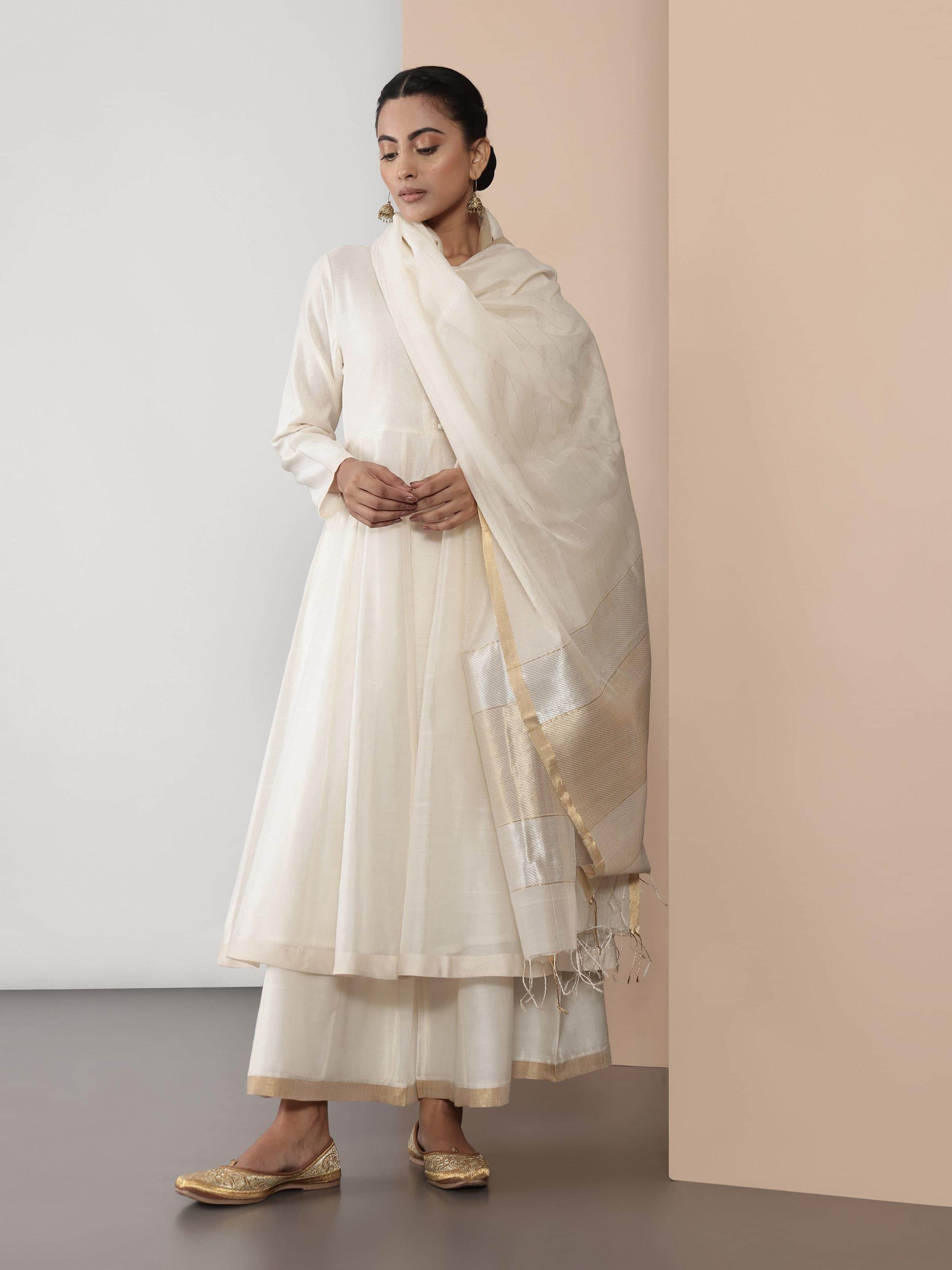 Model wearing off-white Chanderi Anarkali kurta styled elegantly for a traditional look.