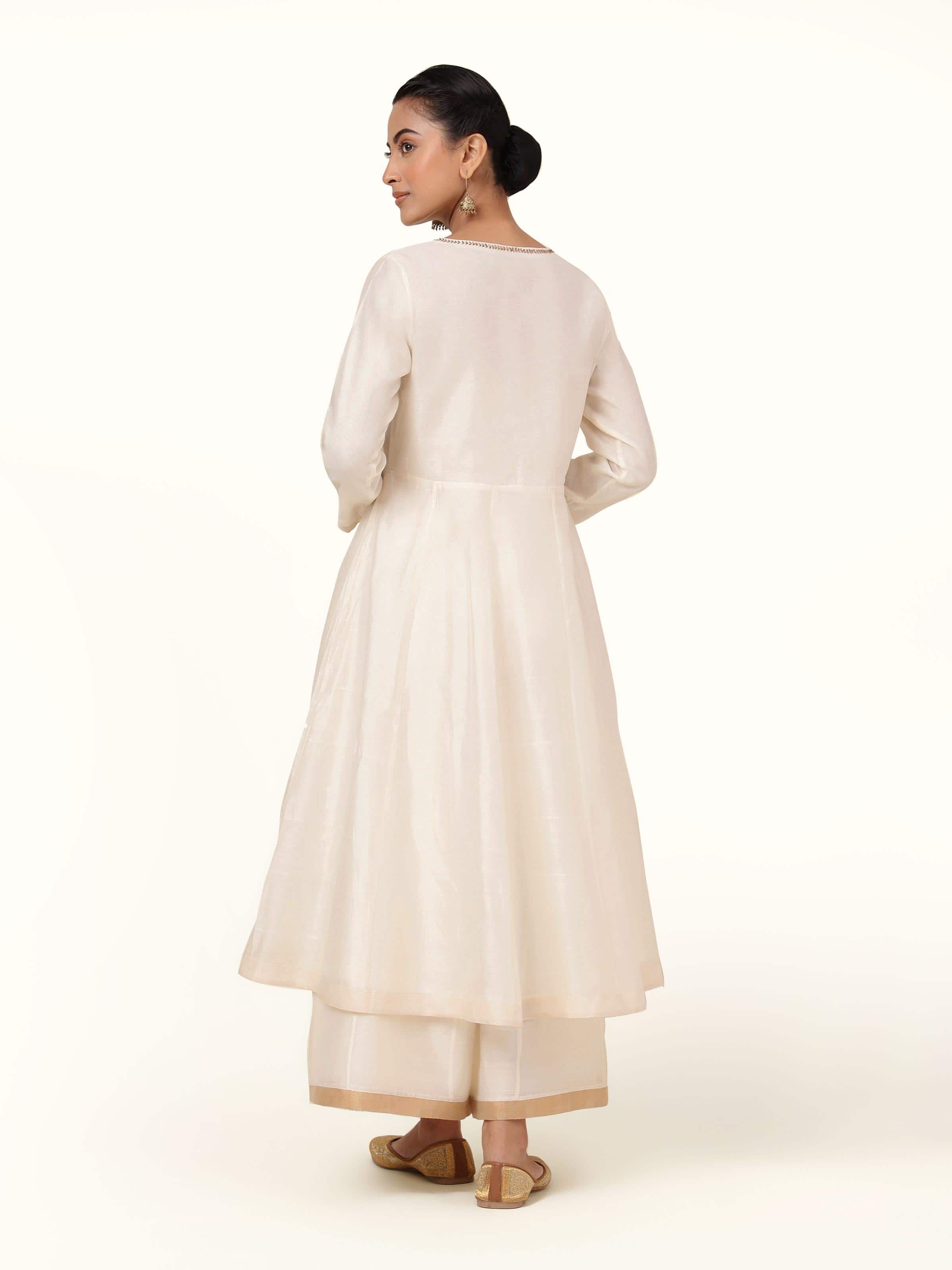 Back view of off-white cotton silk Chanderi Anarkali kurta highlighting its elegant silhouette and fall.