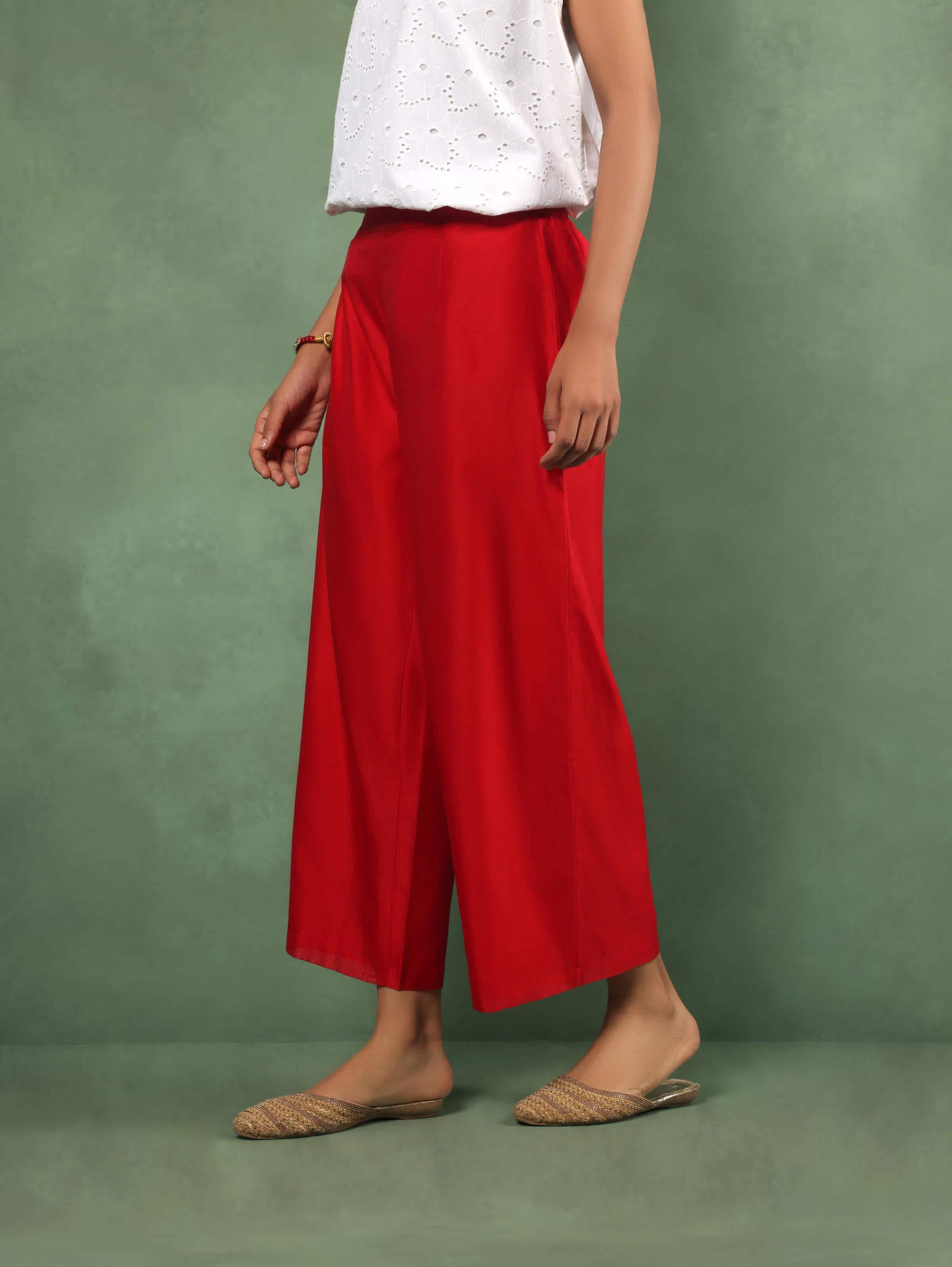 Angled view showcasing flare and texture of red cotton silk palazzo