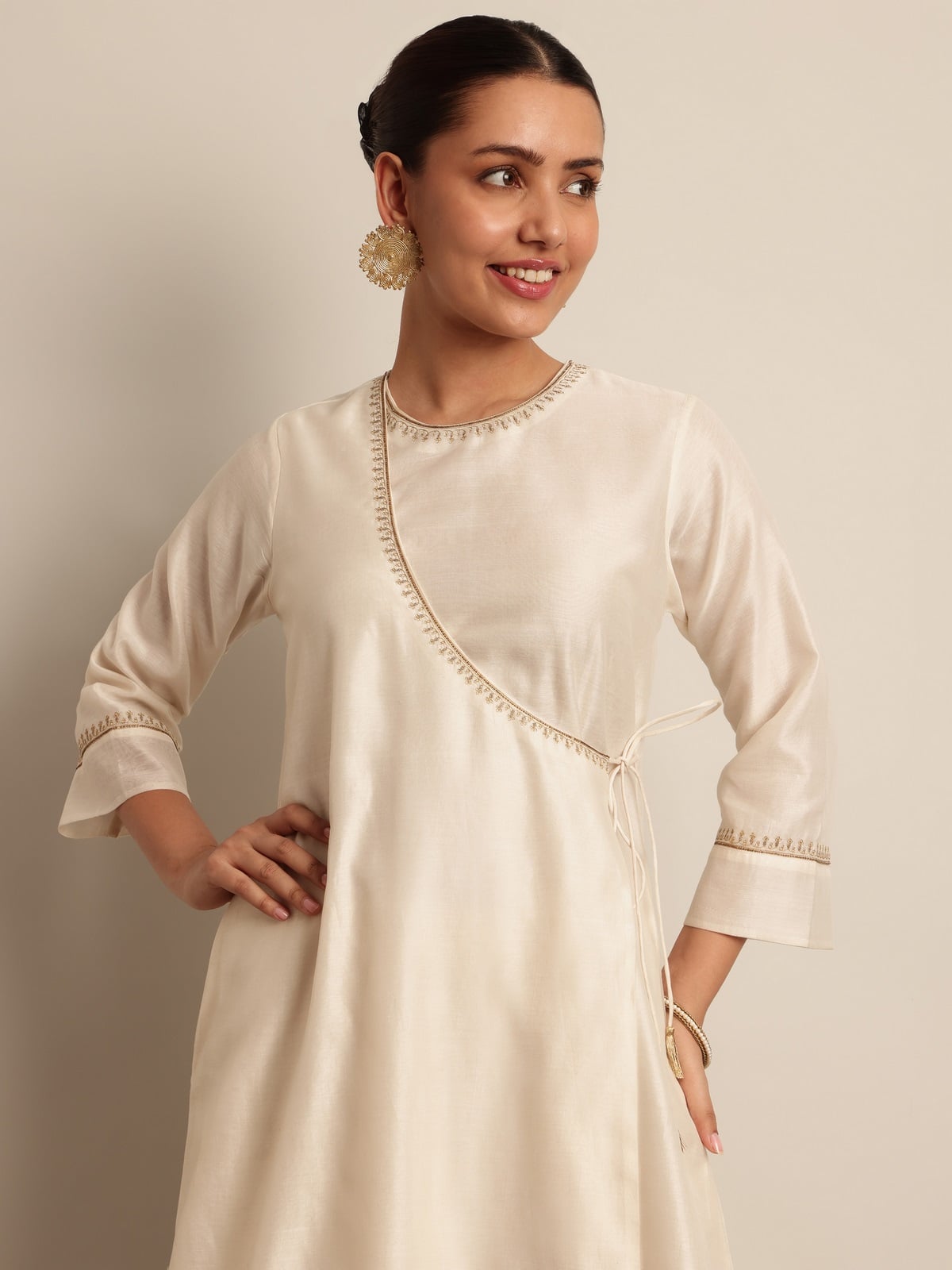 Angled view of Off-white Cotton Silk Angrakha Kurta on model, showing intricate detailing and natural fall.