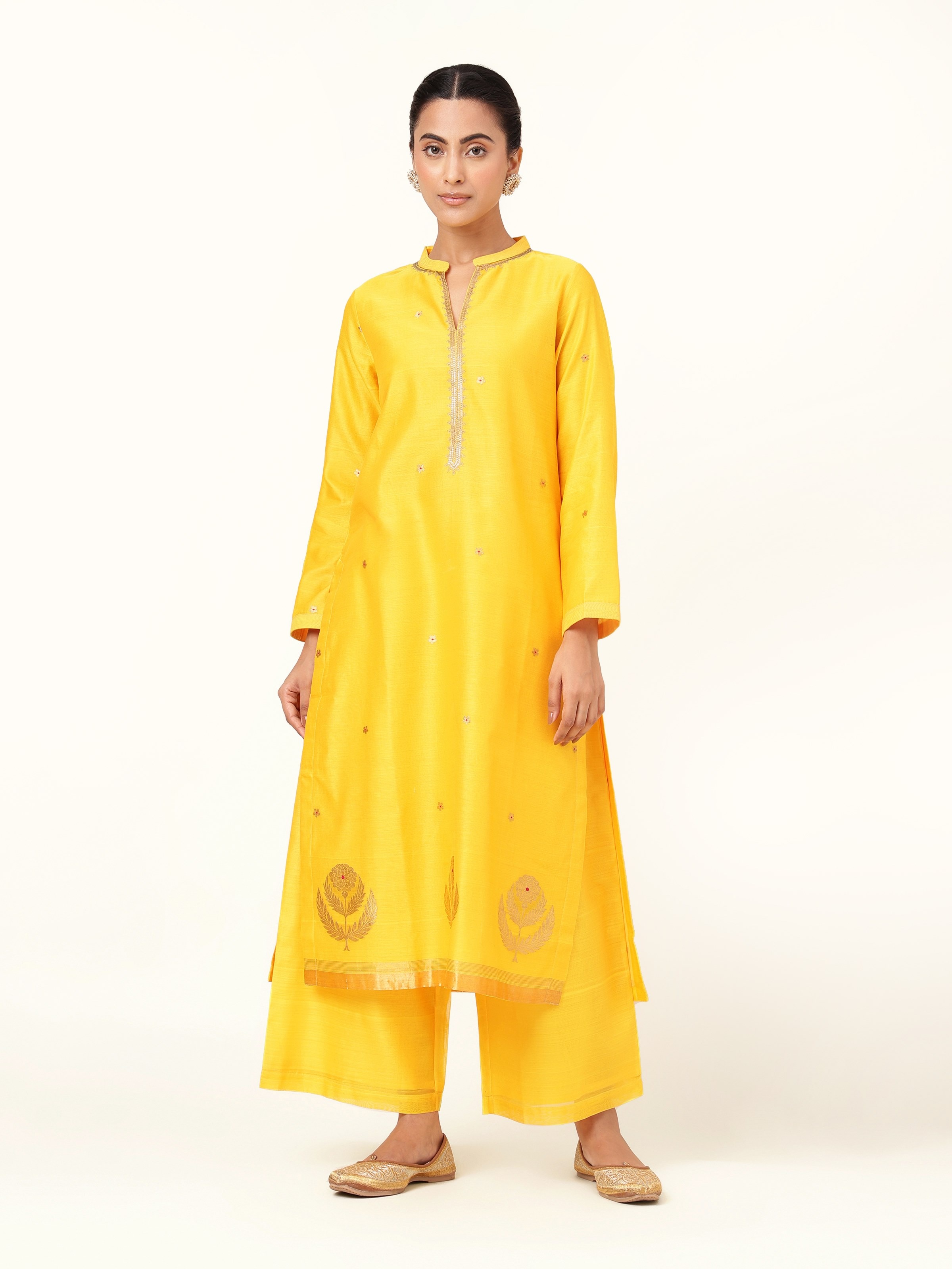 Front view of yellow cotton silk Chanderi A-line kurta with round neckline and subtle sheen.