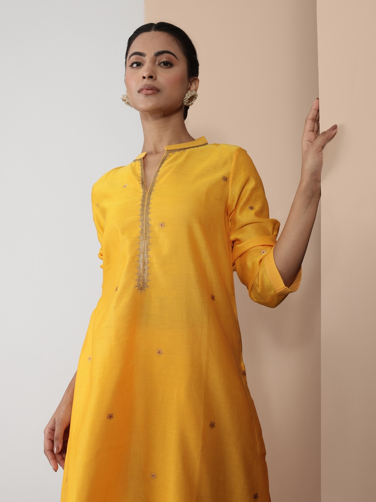 Alternate lifestyle image of yellow Chanderi kurta showing flowy hem and elegant styling.