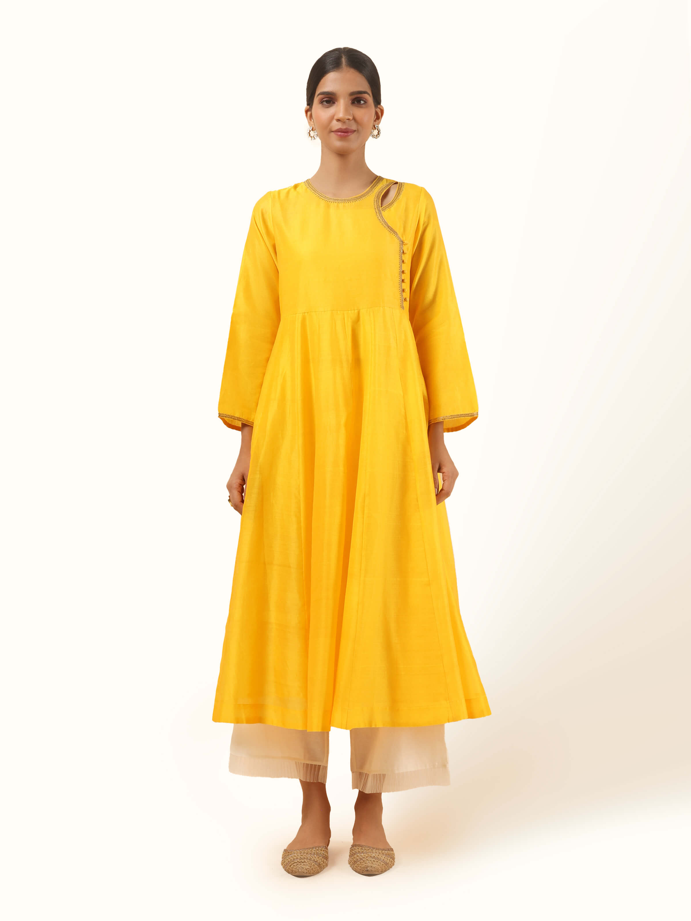 Front view of yellow cotton silk Chanderi Angrakha kurta with side tie-up detail