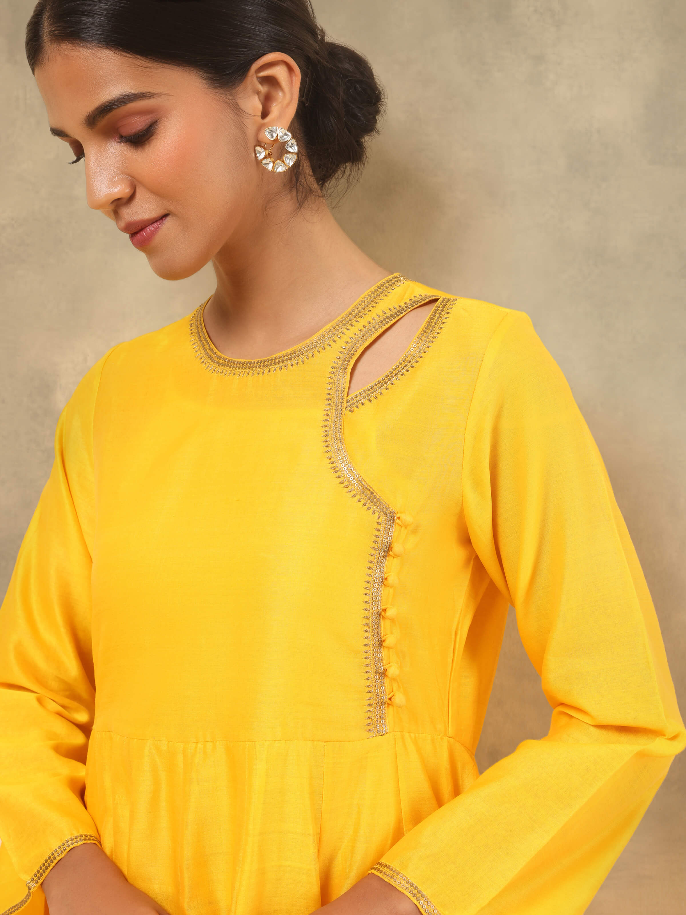 Detail shot of yellow Angrakha kurta showing delicate Chanderi weave
