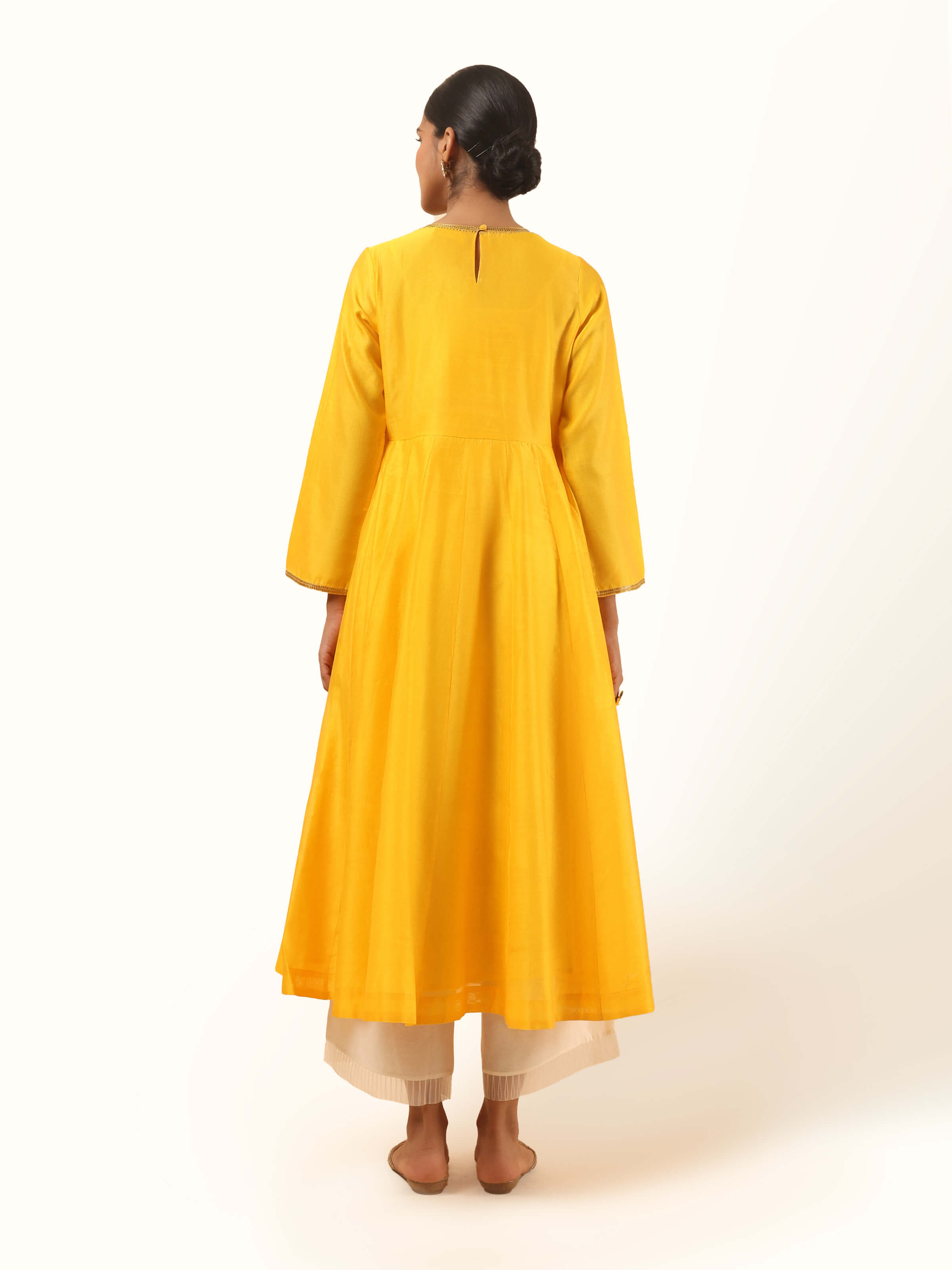 Back view of yellow Chanderi Angrakha kurta with gathered pleats