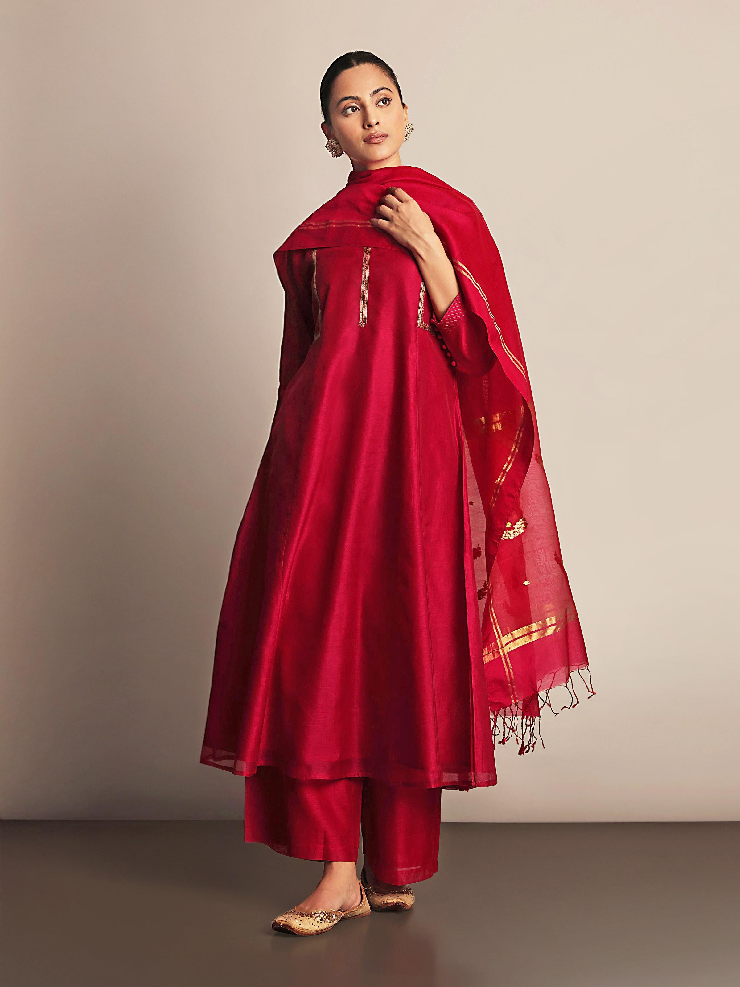Lifestyle shot of fuschia Chanderi kurta worn with minimal accessories