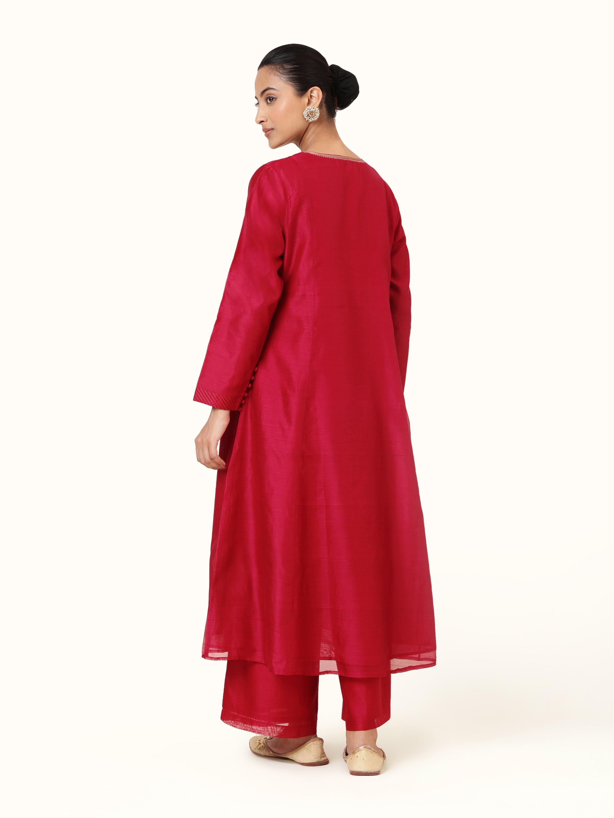 Back view showing kurta’s simple cut and soft drape in cotton silk