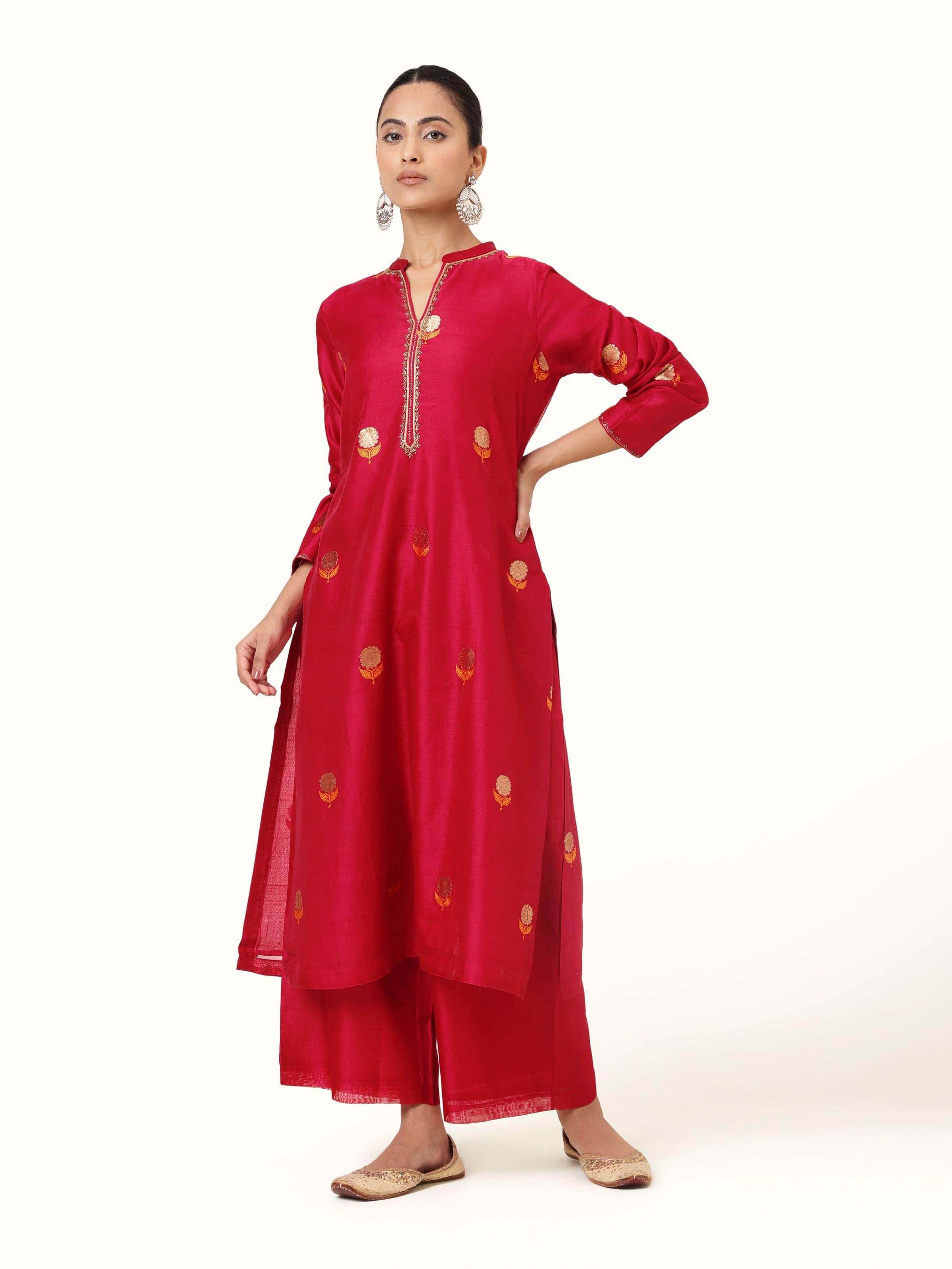 Front view of fuschia cotton silk Chanderi A-line kurta adorned with marigold zari buti embroidery.