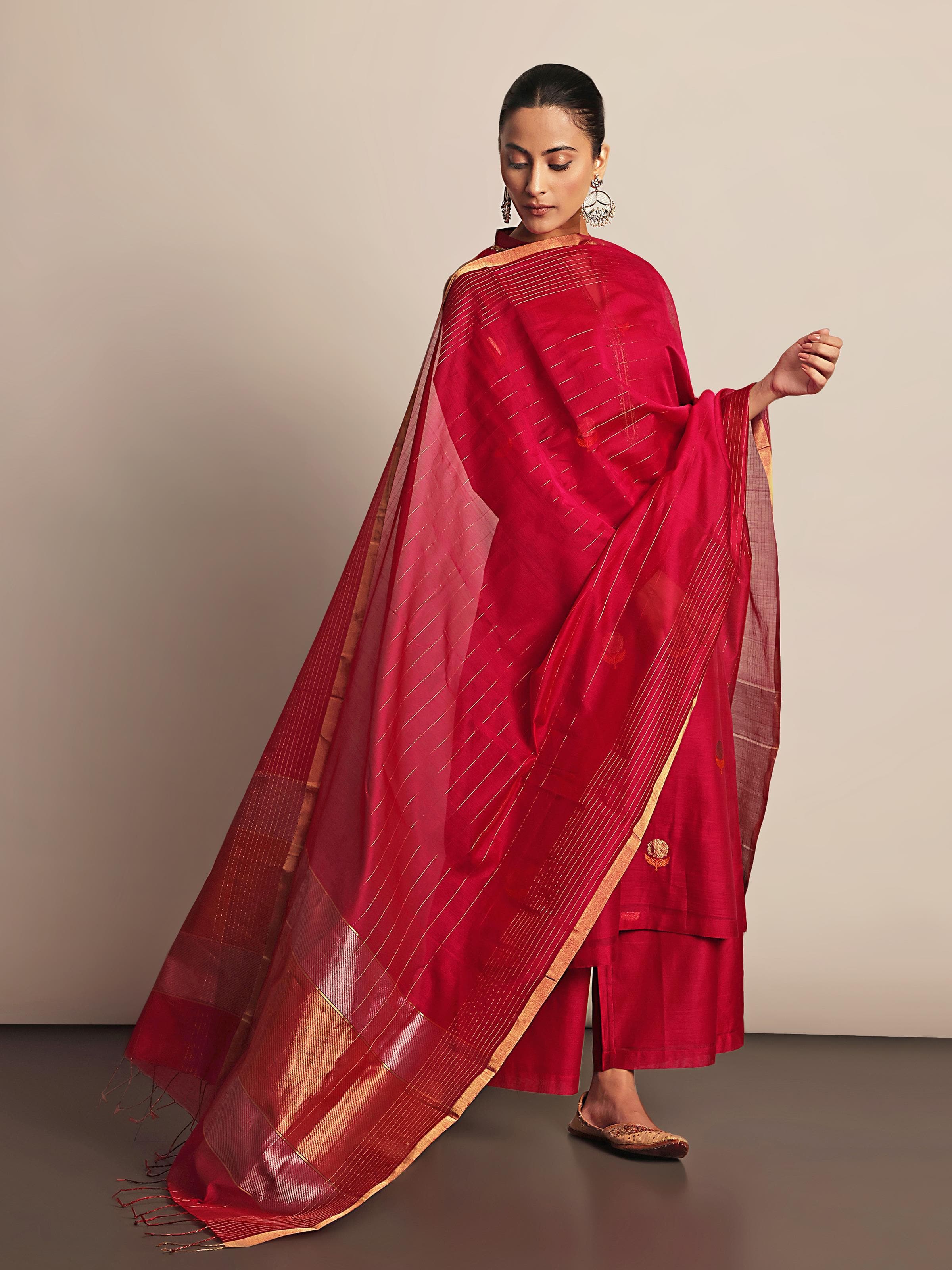 Lifestyle view of fuschia cotton silk Chanderi kurta showing silhouette and embroidery details.