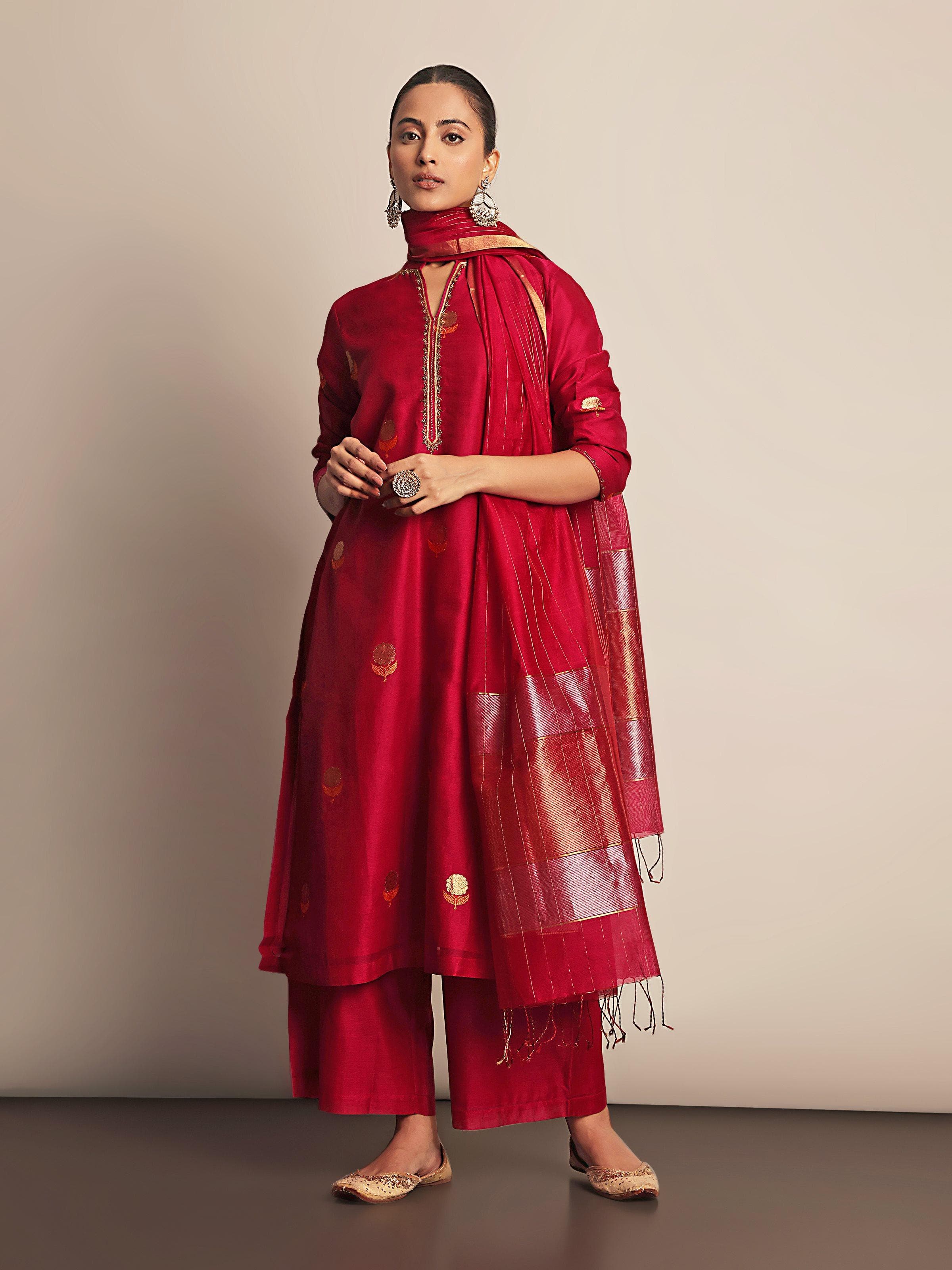 Angled view of A-line kurta highlighting fabric texture and zari buti motifs.