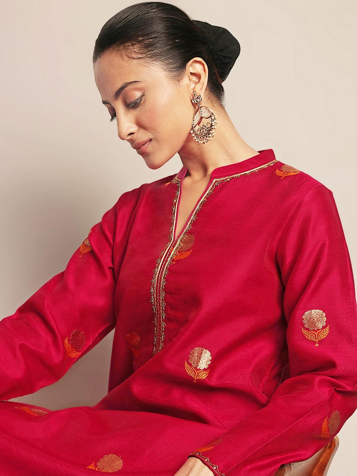 Close-up detail of marigold zari embroidery on cotton silk Chanderi kurta.