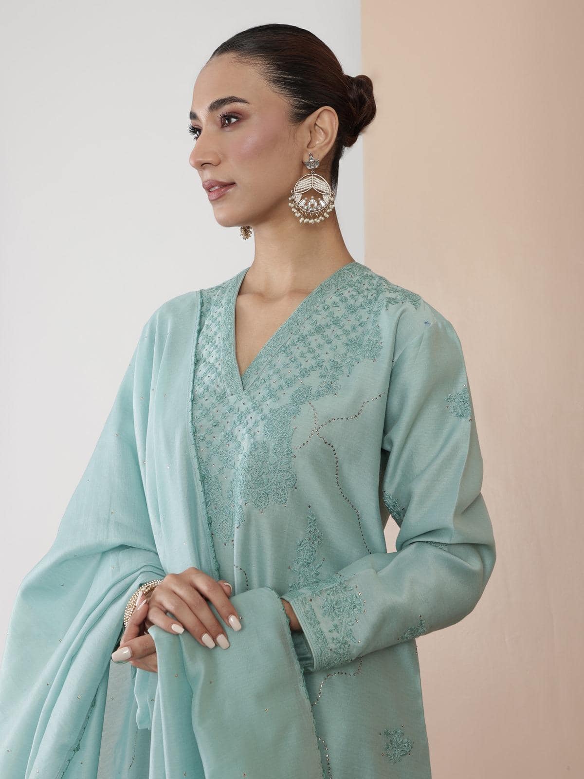 Side lifestyle view highlighting the embroidery and kurta silhouette.