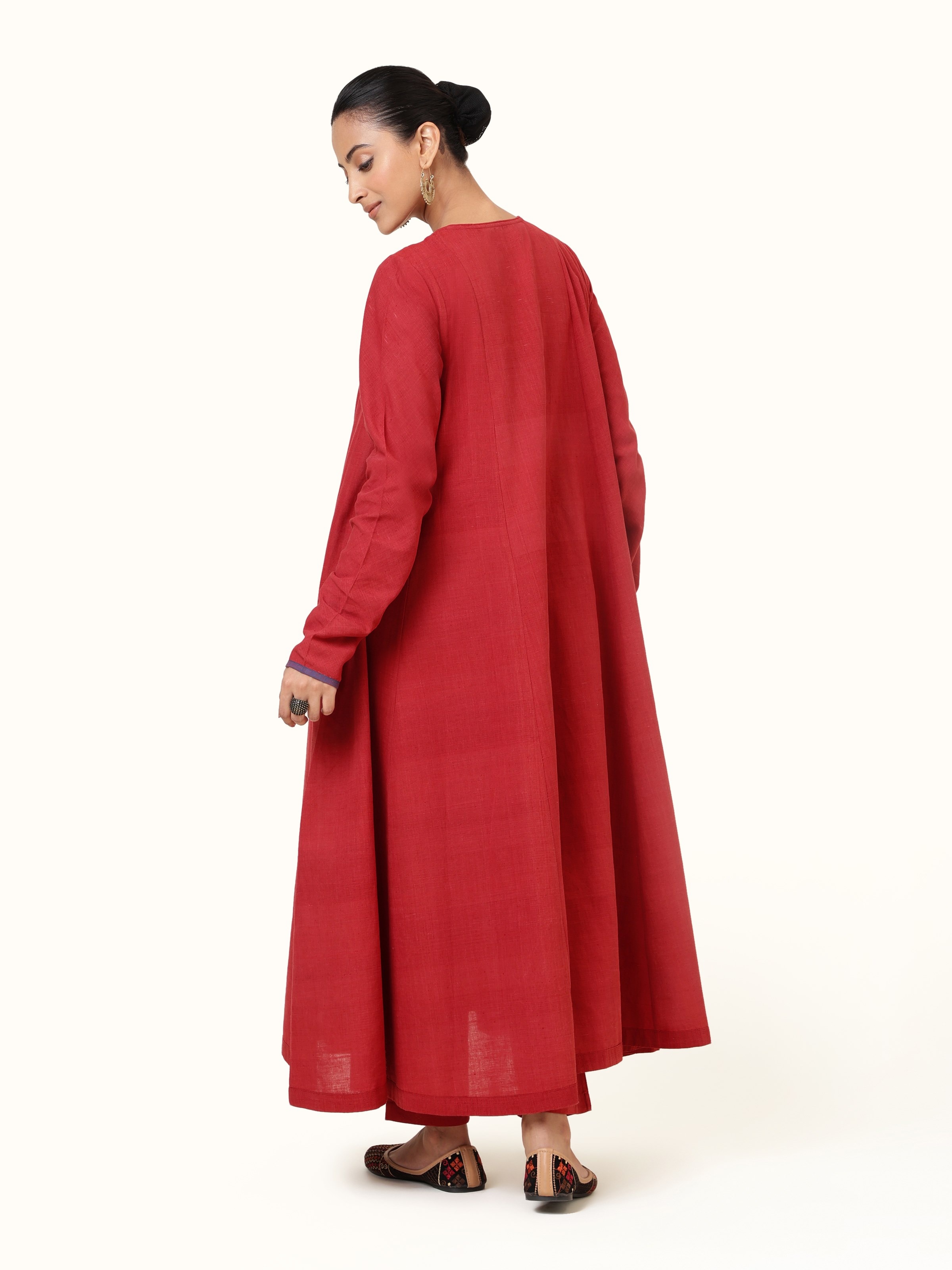 Back view revealing the full length and clean tailoring of the Anarkali design