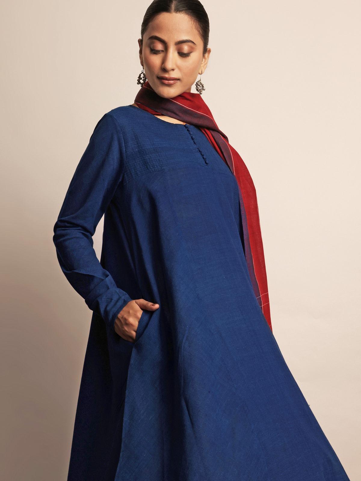 Side lifestyle view of indigo Anarkali kurta showing its flowy hem and comfortable fit