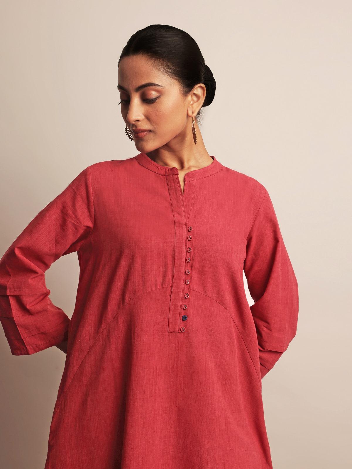 Another angle highlighting the clean tailoring and elegant simplicity of the A-line shape.