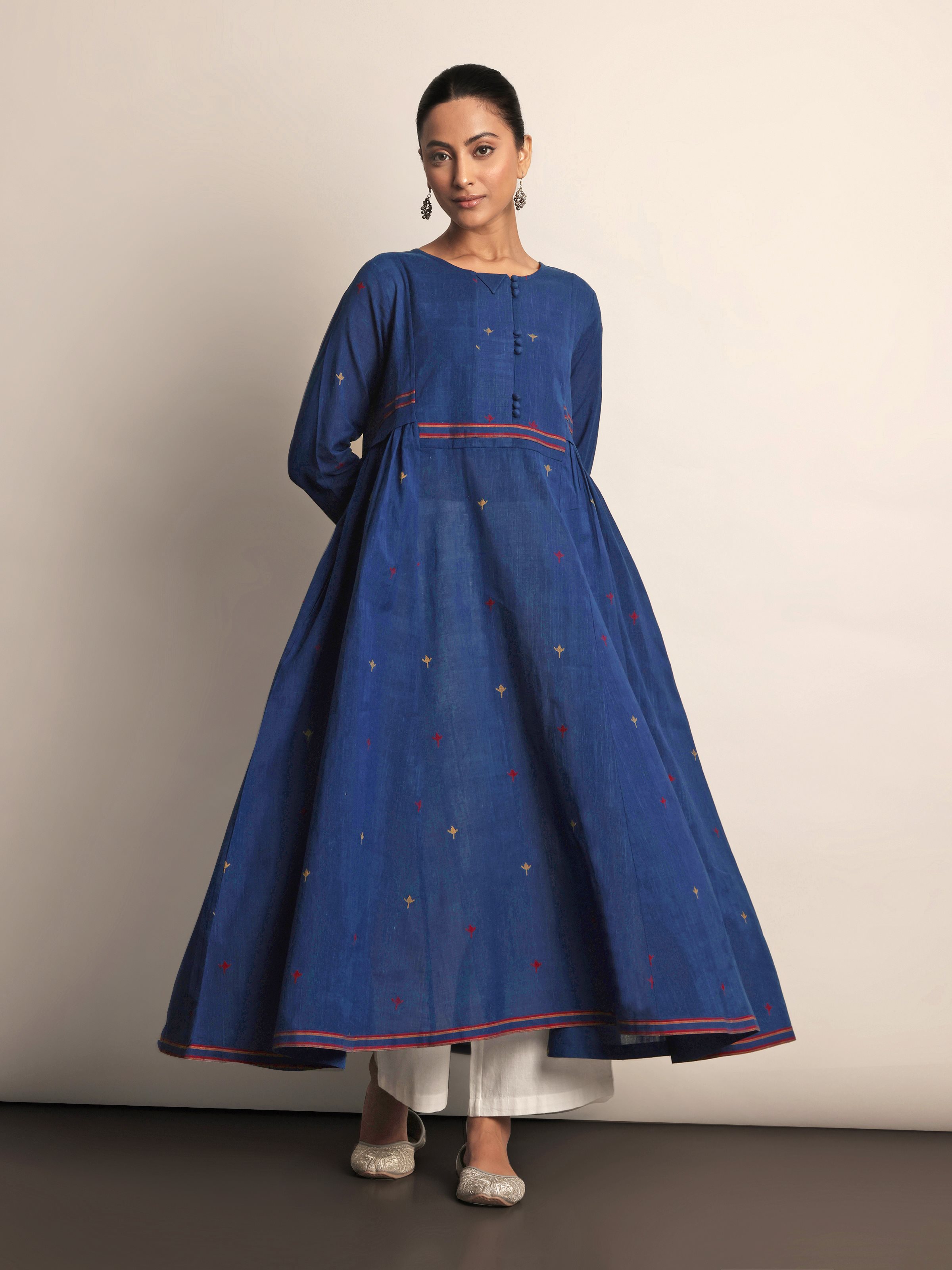 Lifestyle view of Indigo Cotton A-Line Kurta worn casually with jeans.