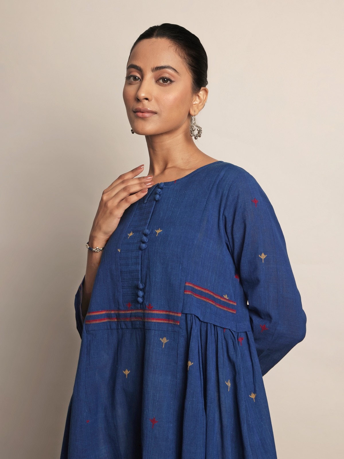 Angled side view of Indigo Cotton A-Line Kurta highlighting sleeve and hem details.
