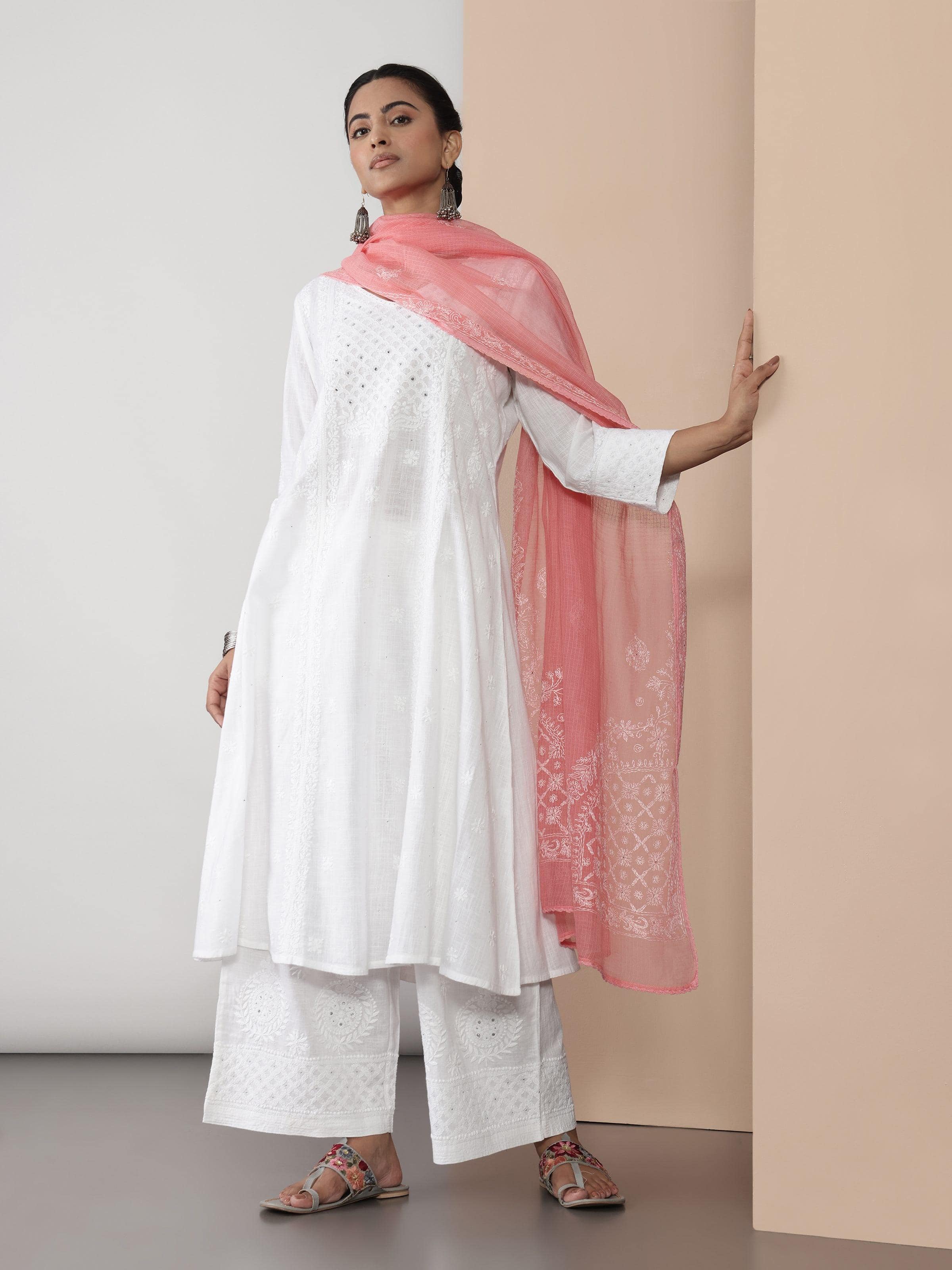 Model wearing white Chikankari kurta, showcasing the elegant embroidery and relaxed A-line silhouette.