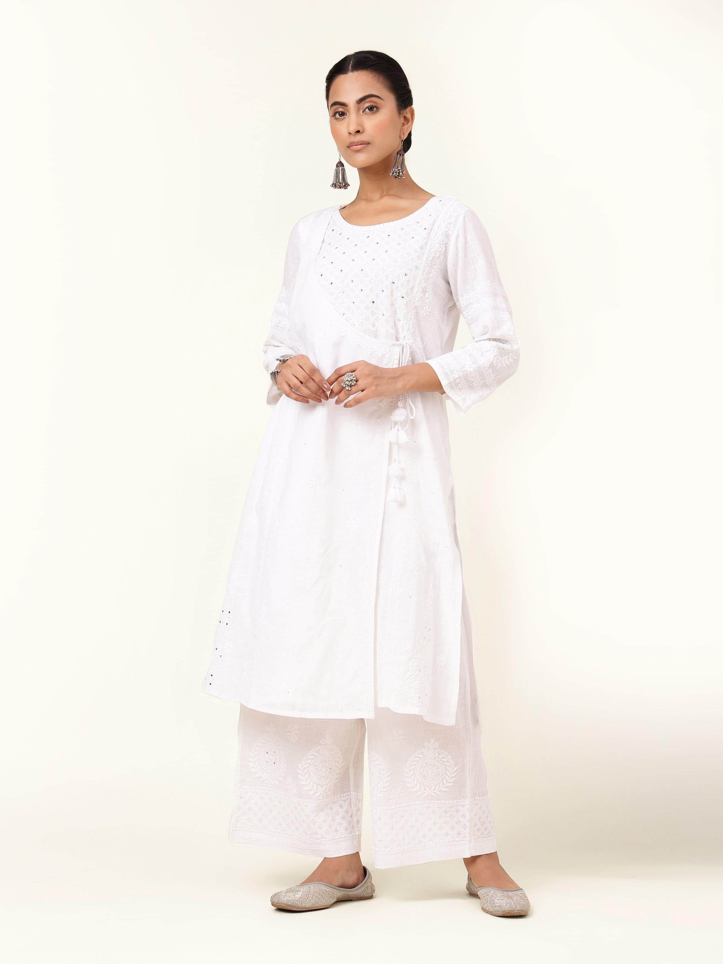 Front view of white cotton Chikankari A-line kurta featuring delicate embroidery and a flared silhouette.