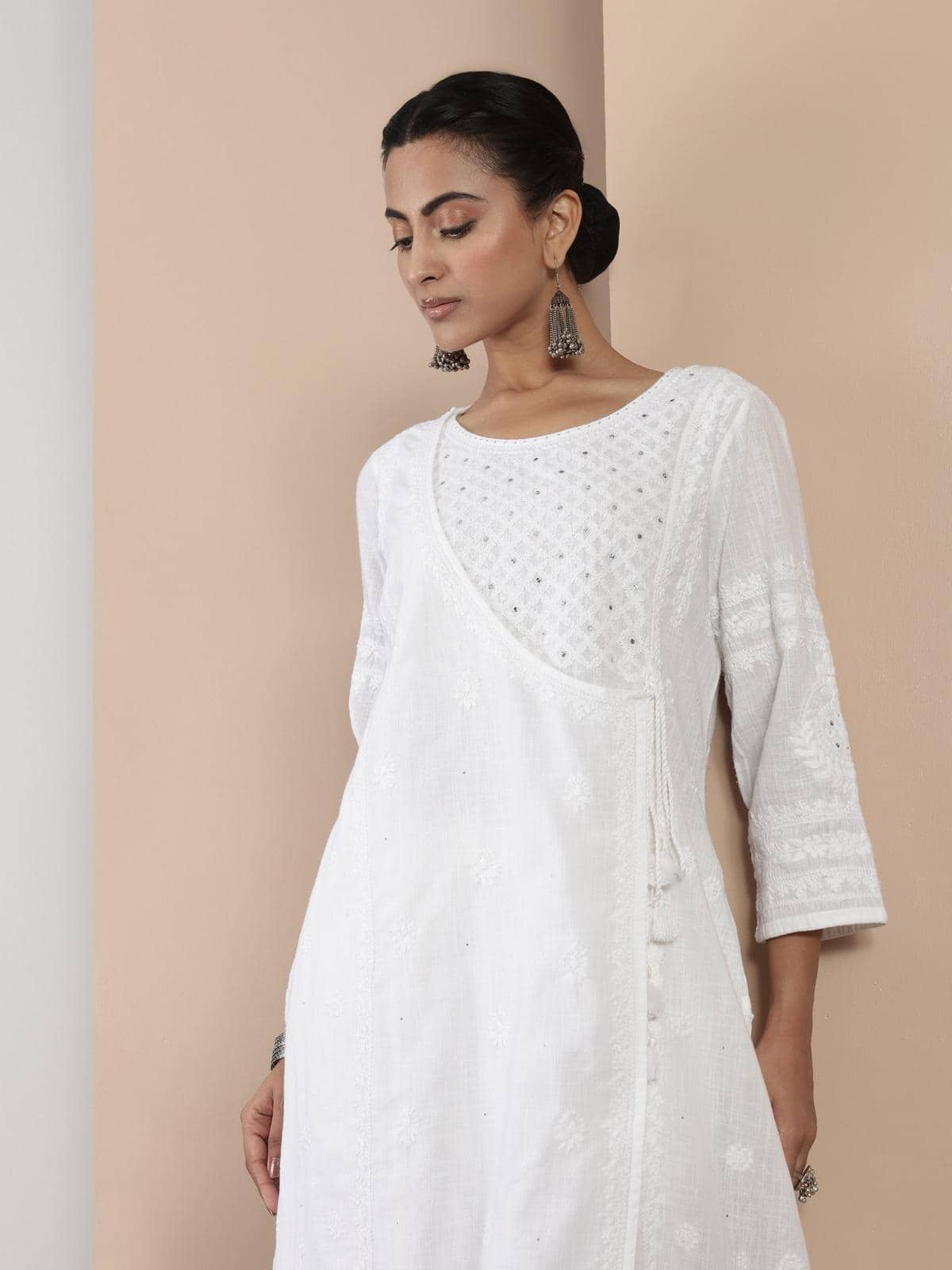Alternate lifestyle view of white Chikankari A-line kurta highlighting its breezy, comfortable design.