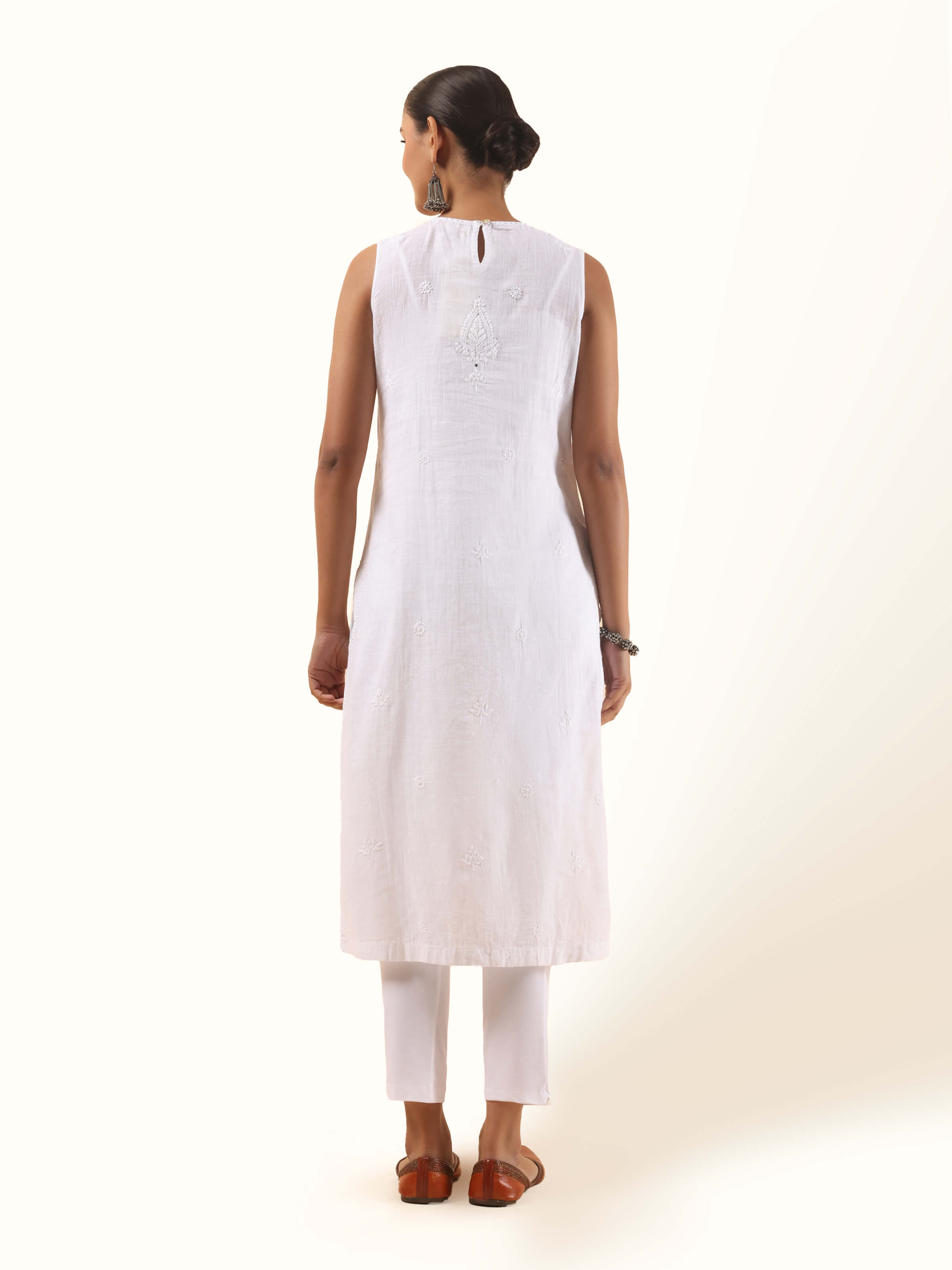 Back view of white Chikankari cotton kurta showing simple cut and clean finish with sleeveless design