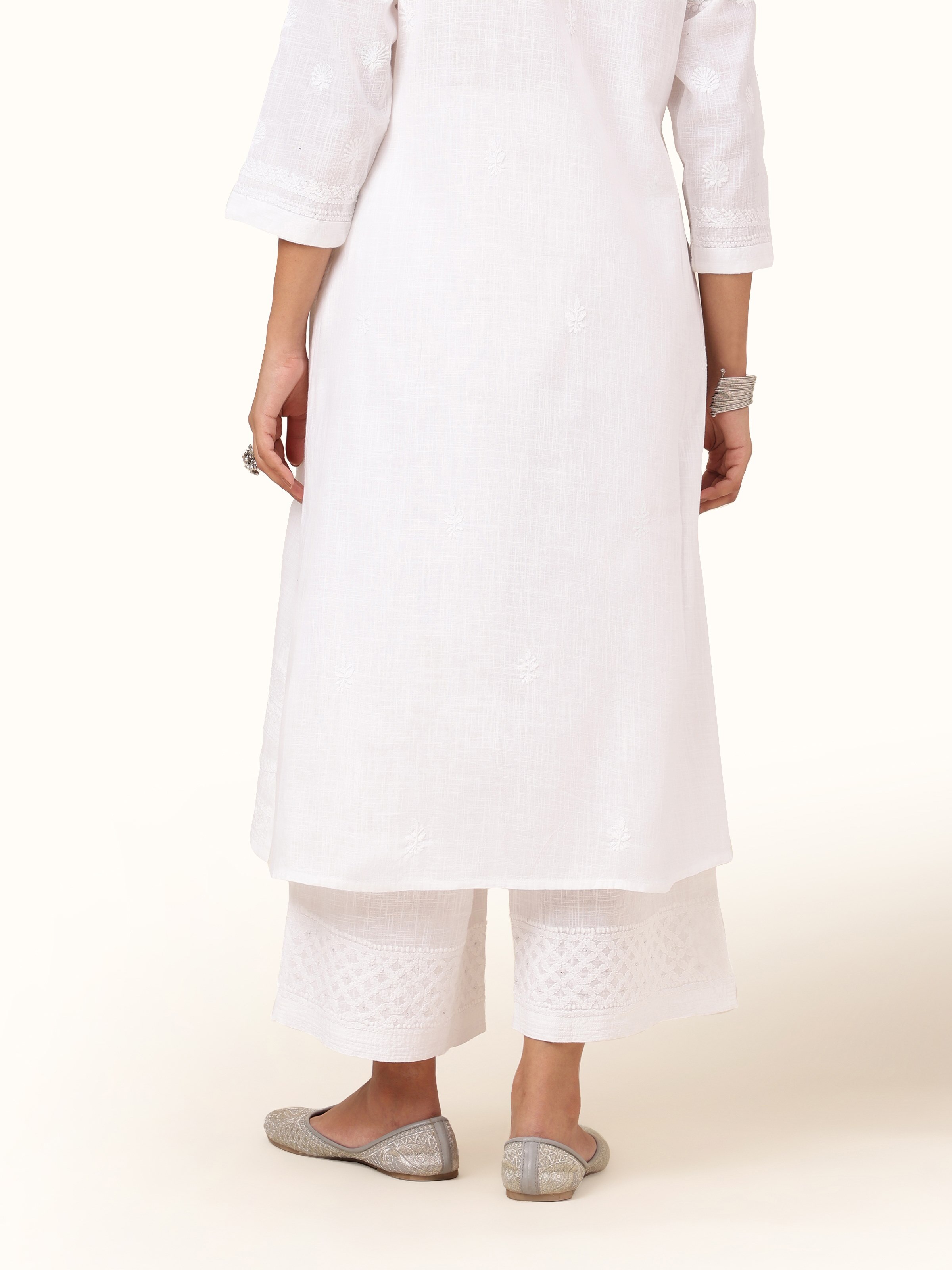 Back view of Chikankari palazzo highlighting elasticated waist and flowy cut.