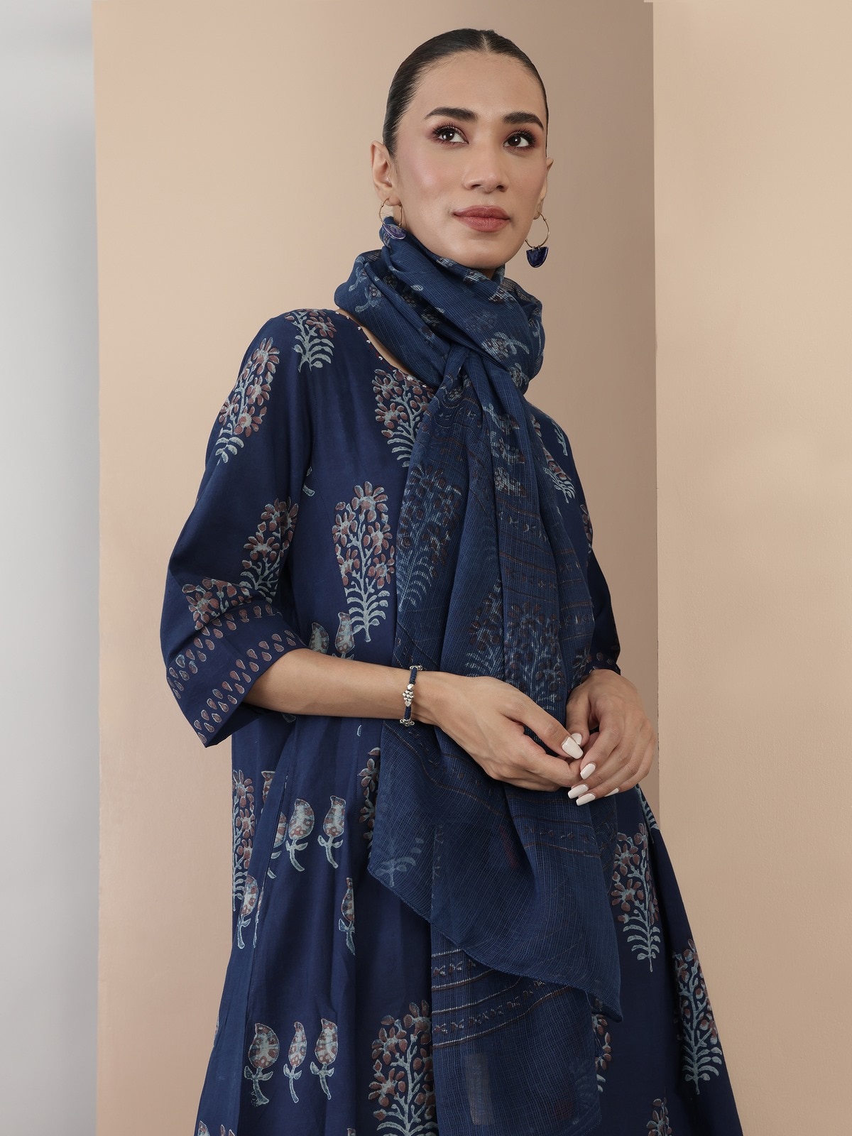 Alternate lifestyle view highlighting flare and pattern of blue cotton Dabu block printed kurta