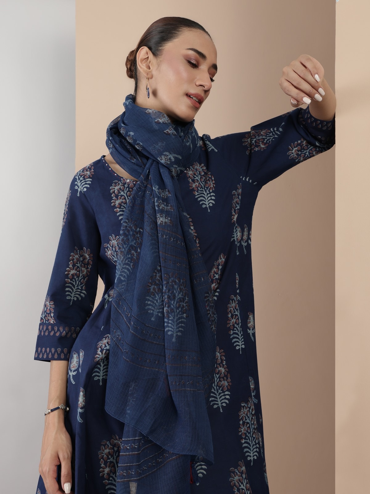 Side lifestyle view of blue flared kurta showcasing block print and fit