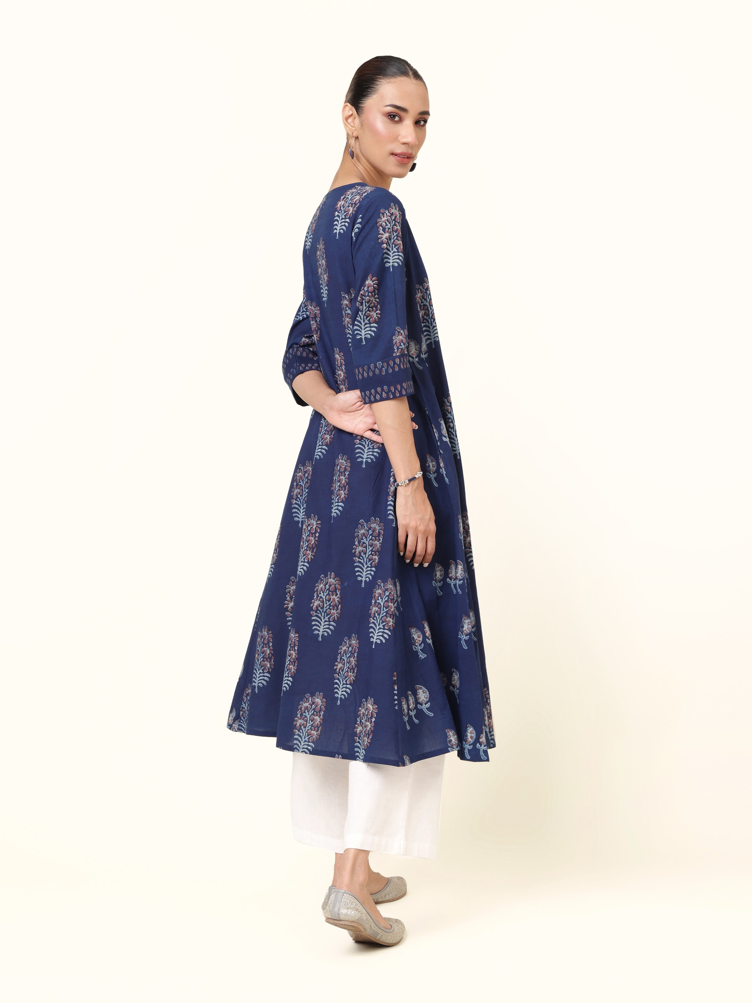 Back view of blue Dabu block printed cotton flared kurta with gathered detailing