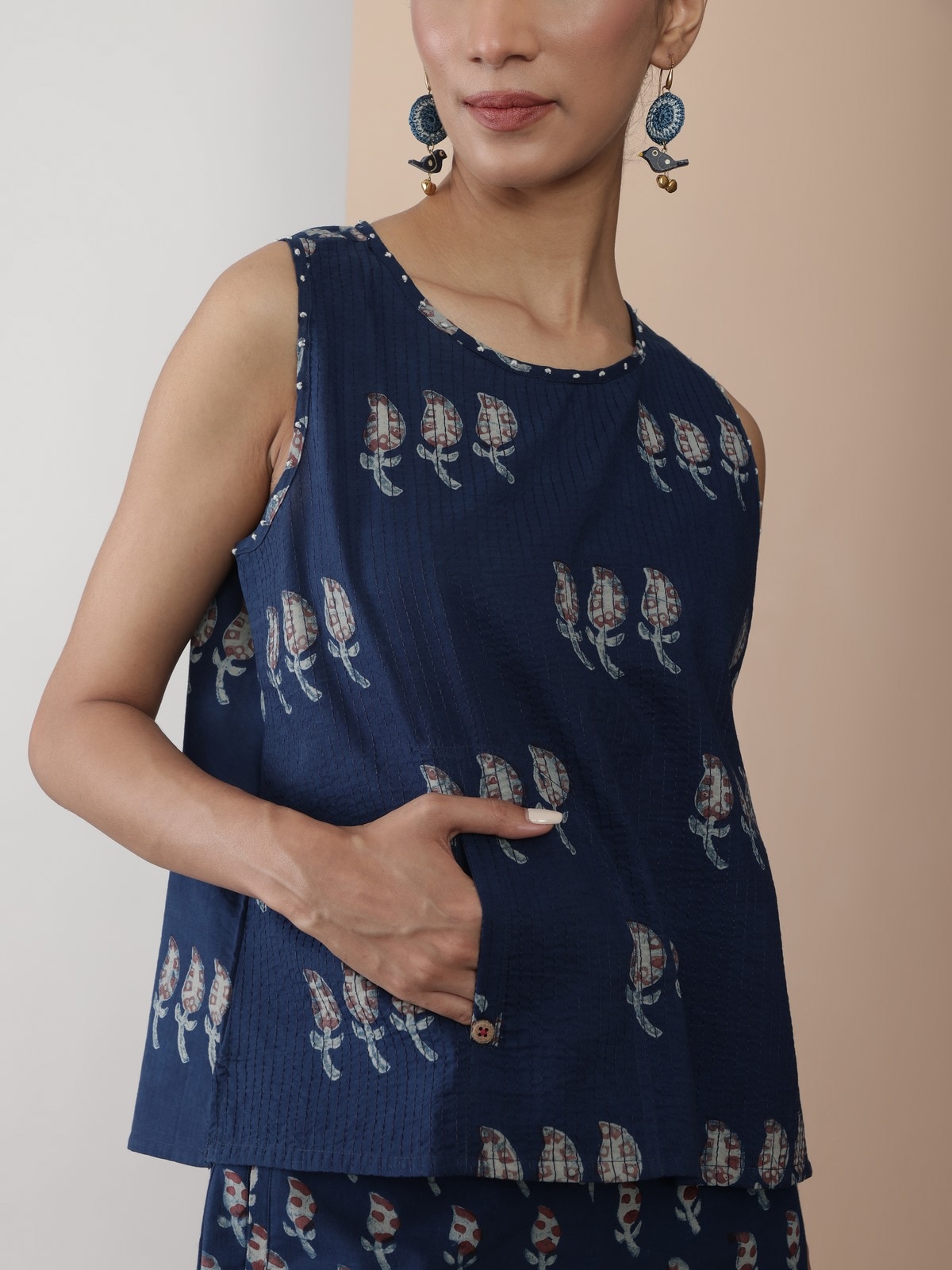 Side angle showcasing the armhole finish and breathable material.