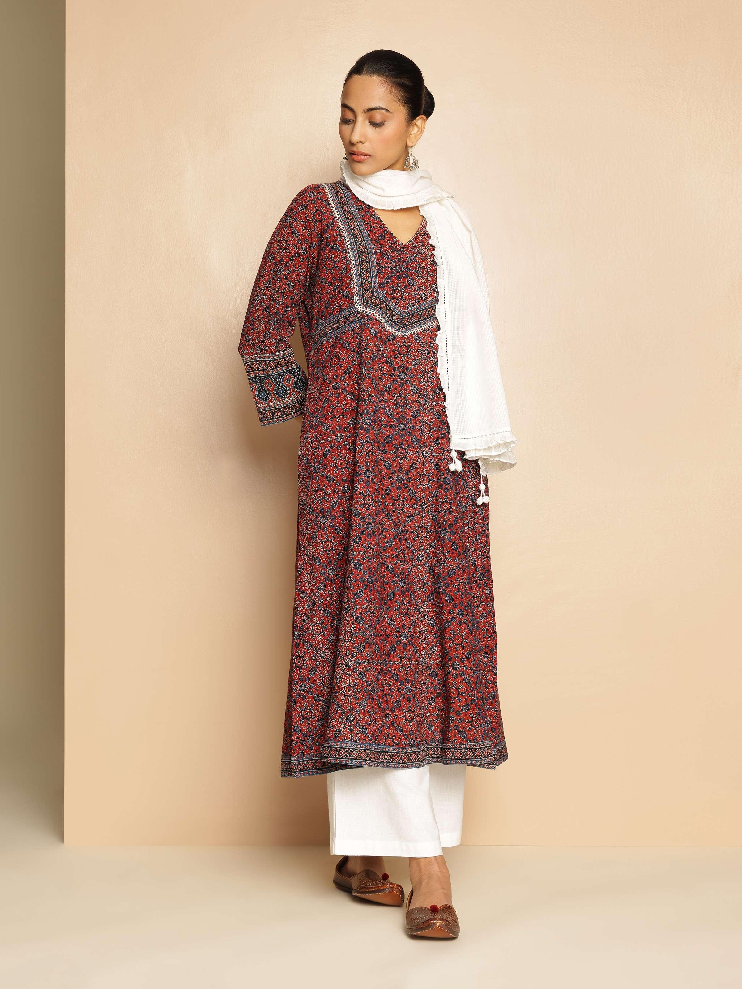Lifestyle view of model wearing Ajrakh block print A-line kurta with three-quarter sleeves