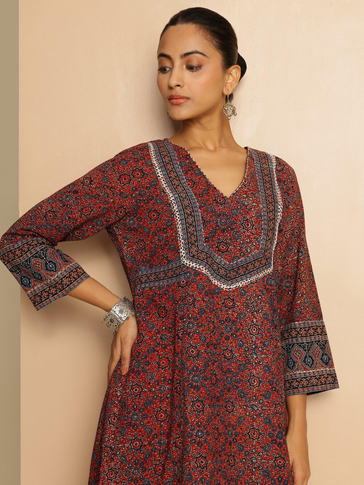 Third lifestyle shot of cotton A-line kurta showing Ajrakh motifs in motion