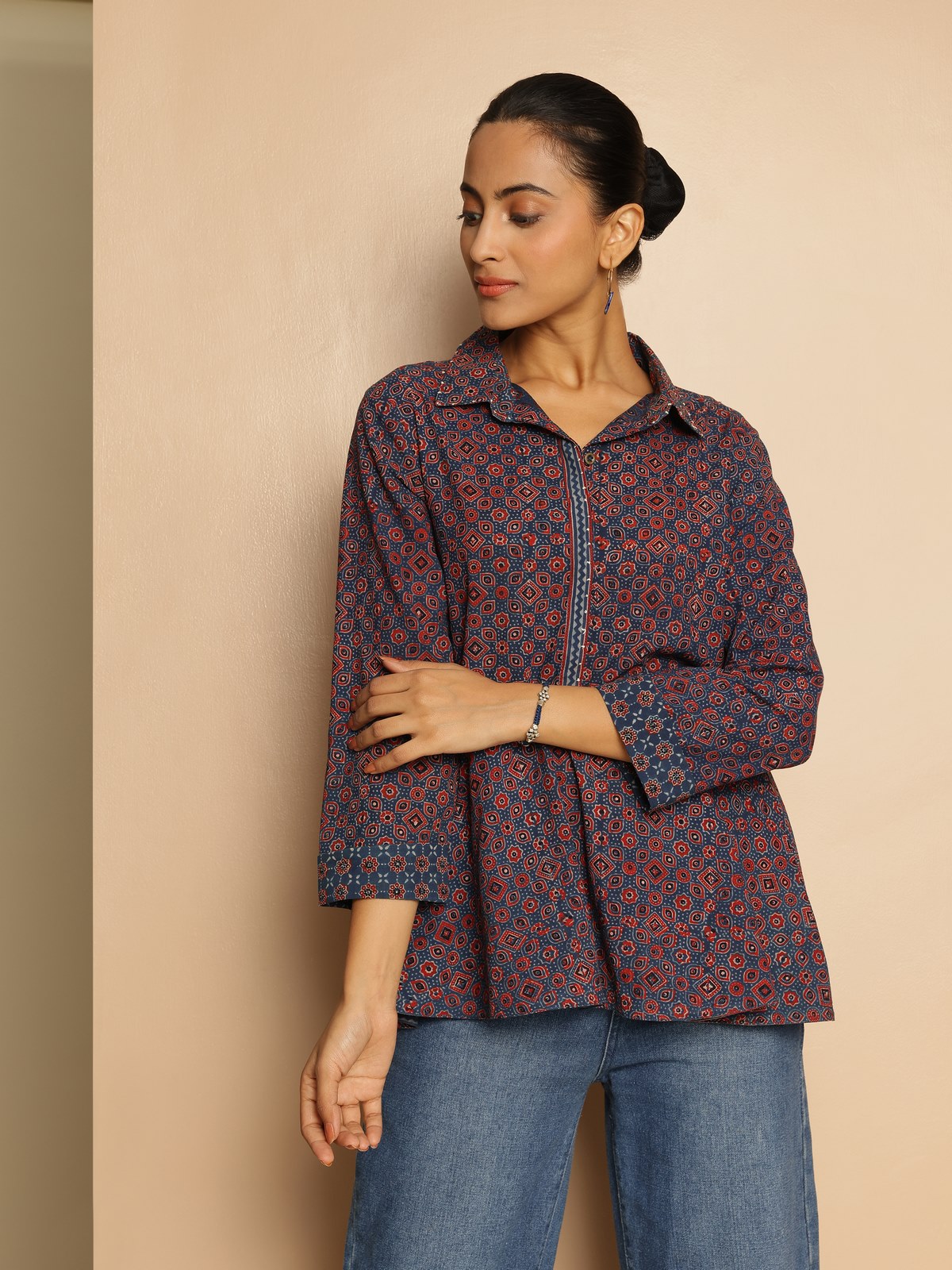 Side lifestyle view highlighting peplum flare and traditional block print