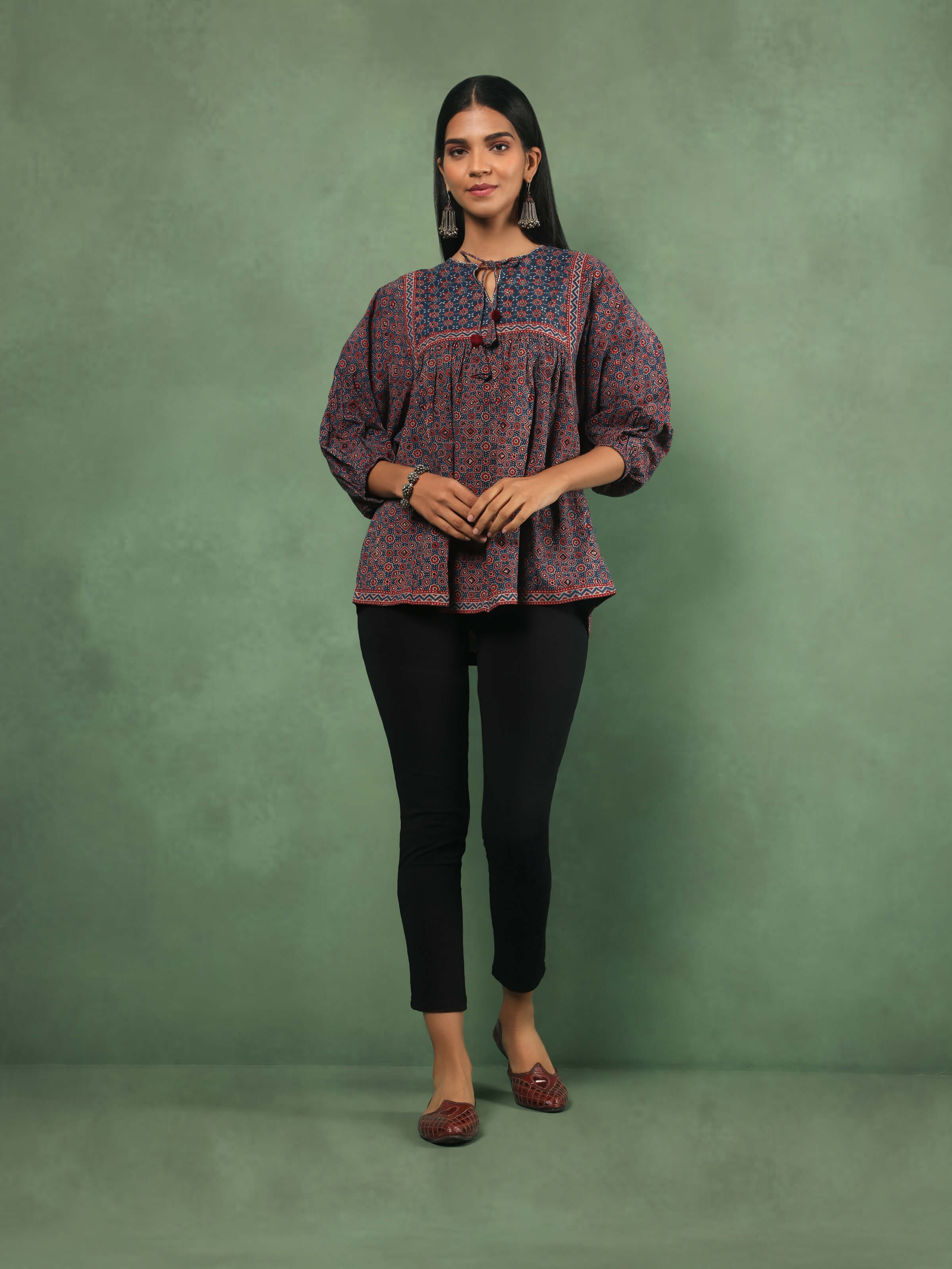 Lifestyle view of red Ajrakh boho top paired with casual bottoms for a relaxed ethnic look