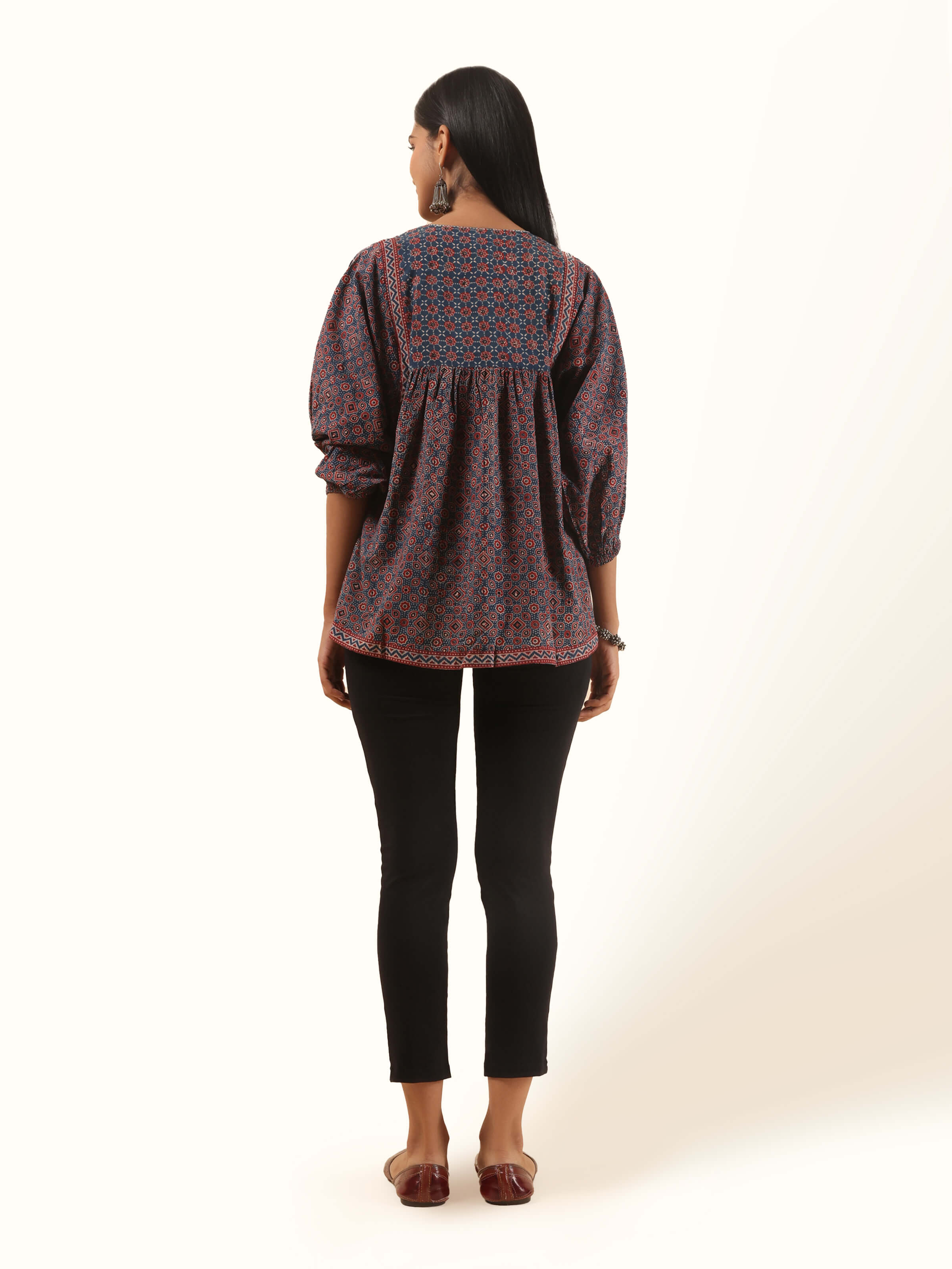 Back view of red cotton Ajrakh boho top showing yoke detail and natural fabric fall