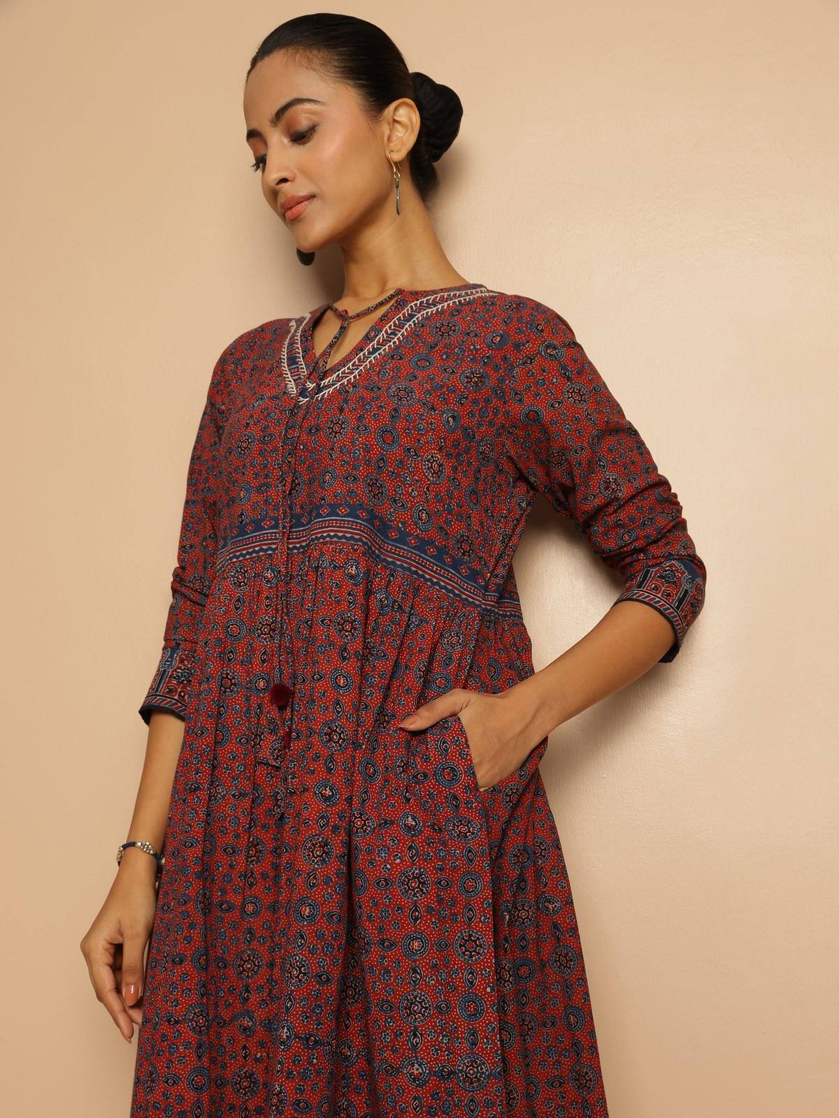 Blue cotton Ajrakh block printed tie-up midi dress second alternate lifestyle view highlighting flare and hemline