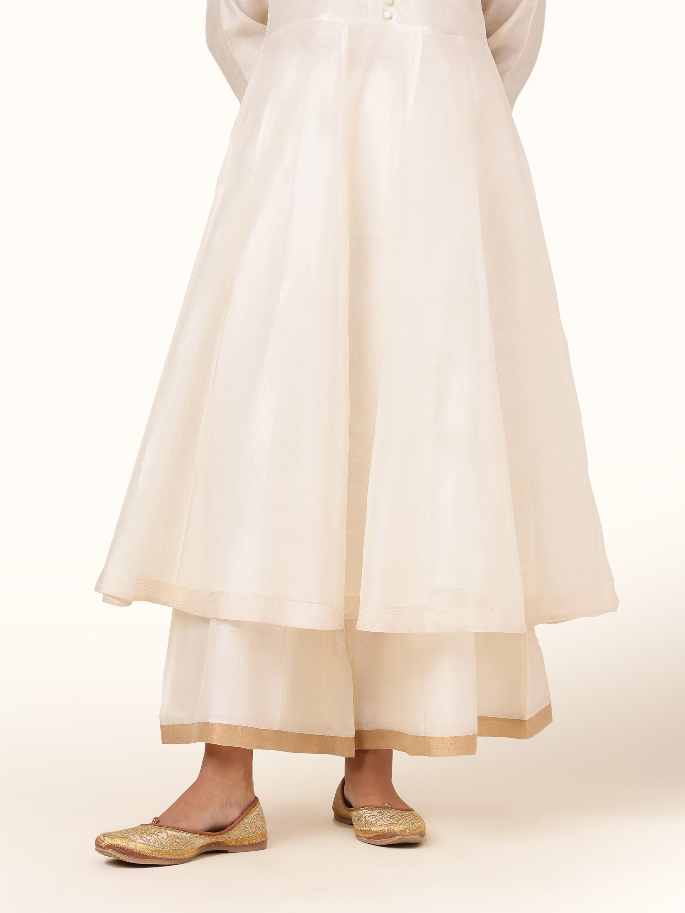 Front view of off-white cotton silk Chanderi sharara with subtle shine.