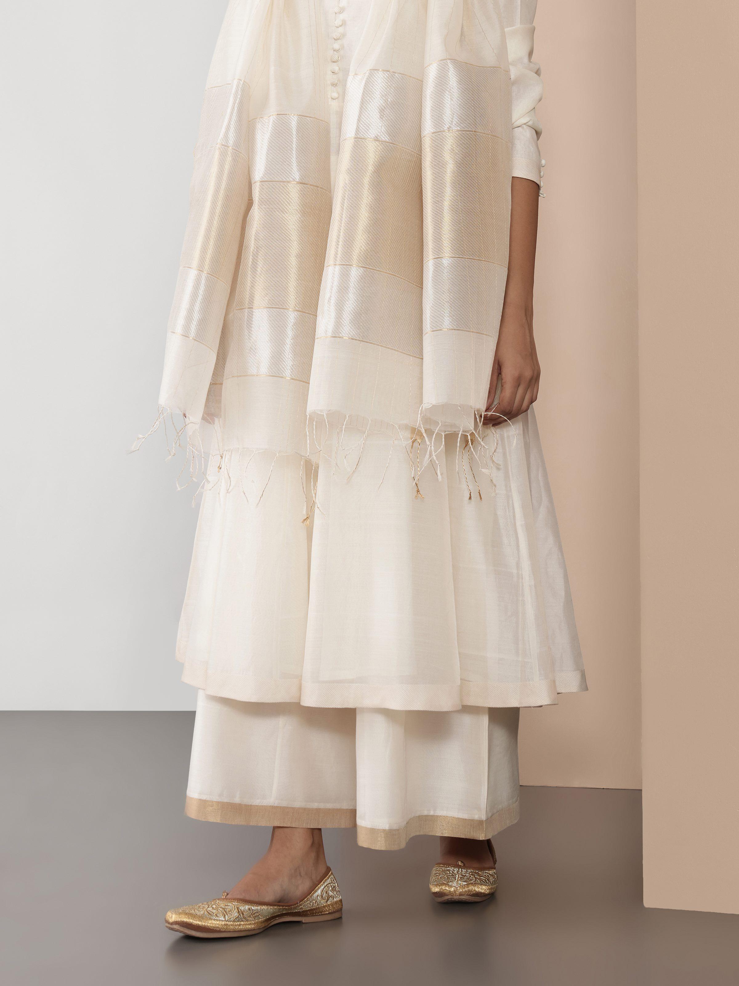 Side view emphasizing soft pleats and airy structure.