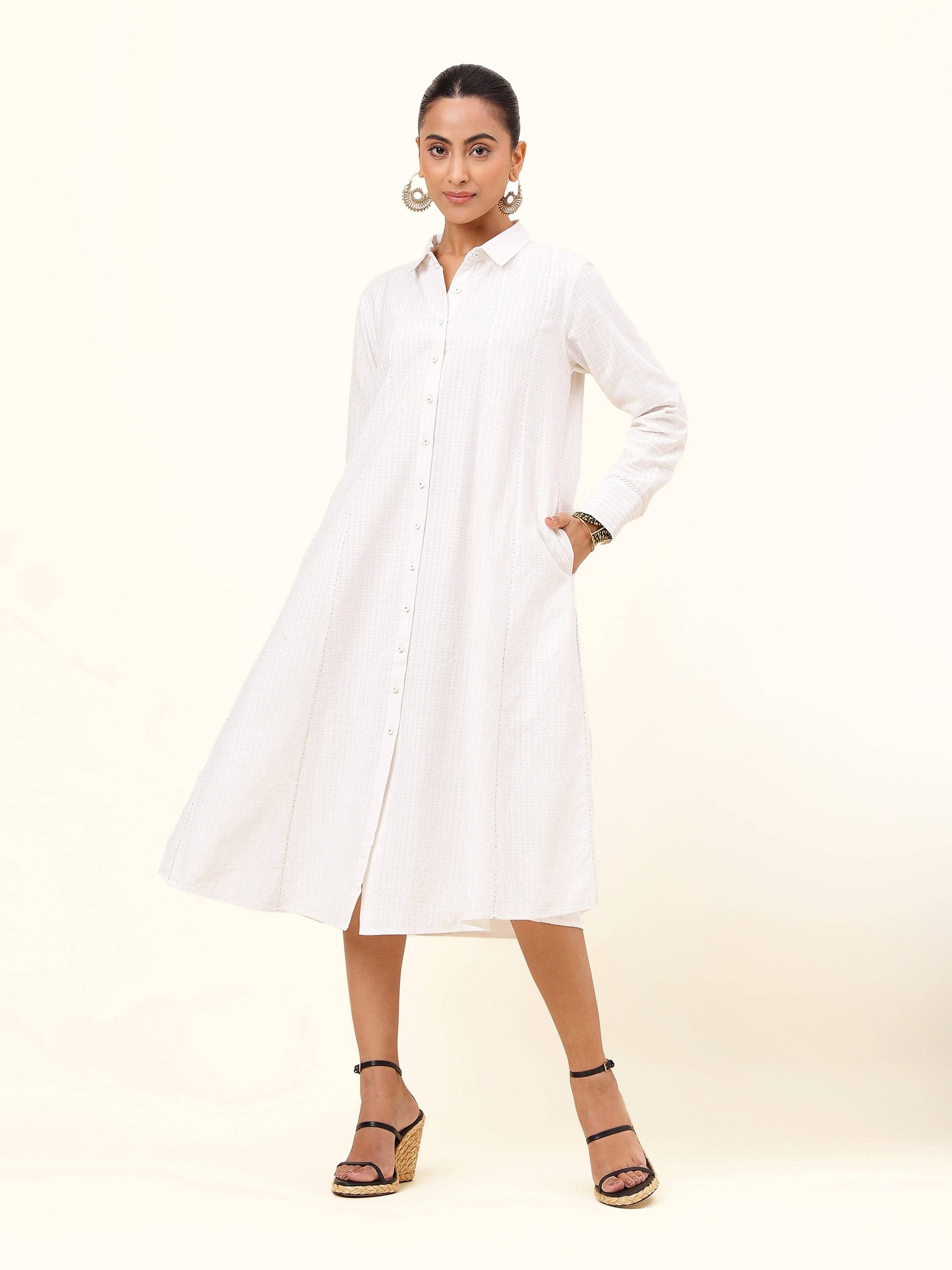 Front view of off-white cotton panelled straight dress with point collar and full sleeves